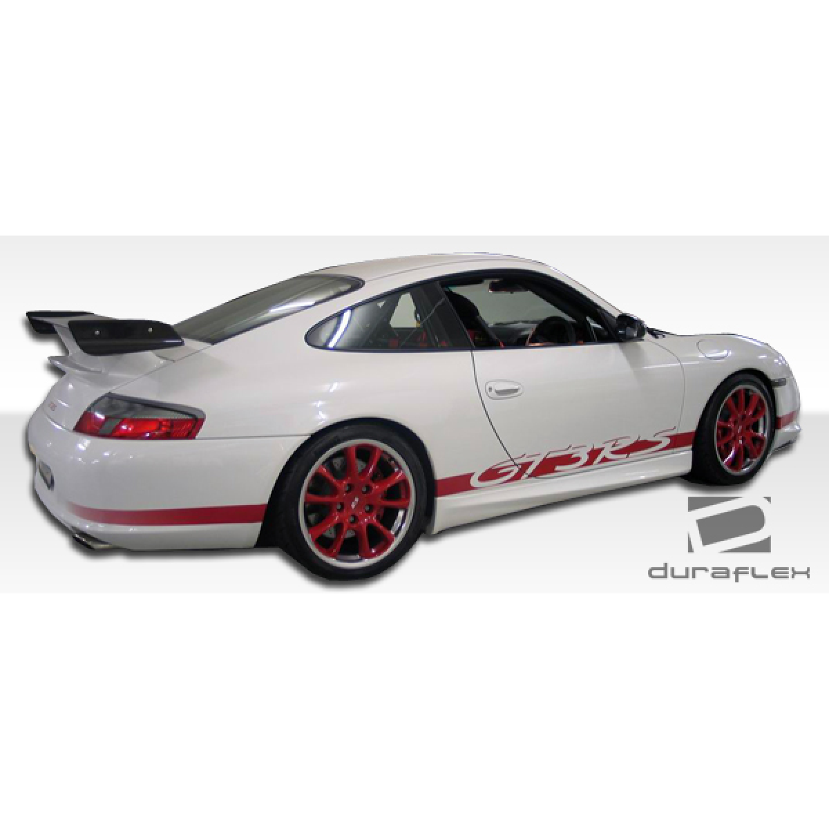 Modify your Porsche 911 1999 with our Exterior/Complete Body Kits - The car is viewed from a rear three quarters angle