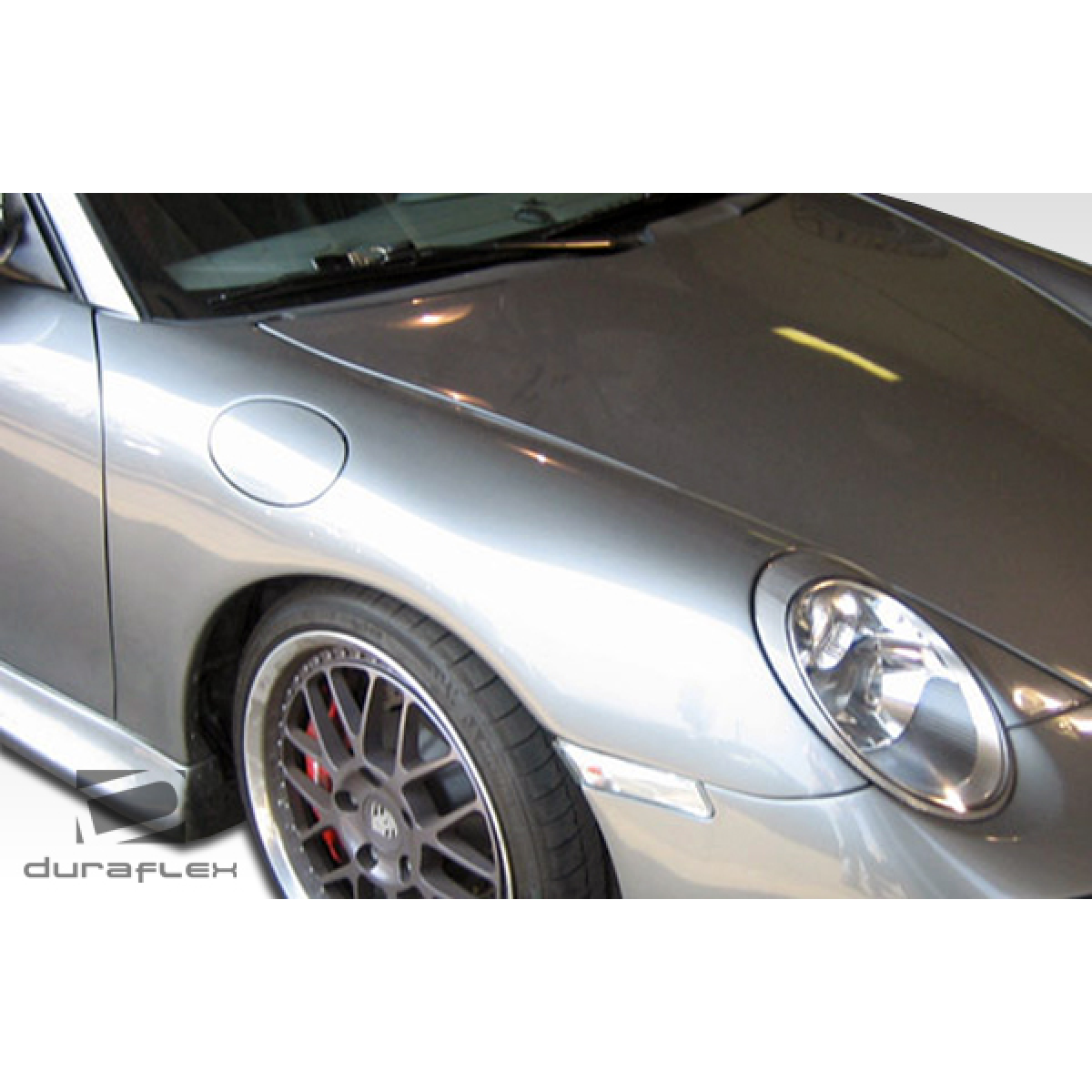 Modify your Porsche 911 1999 with our Exterior/Complete Body Kits - Side angle view of front quarter panel and wheel
