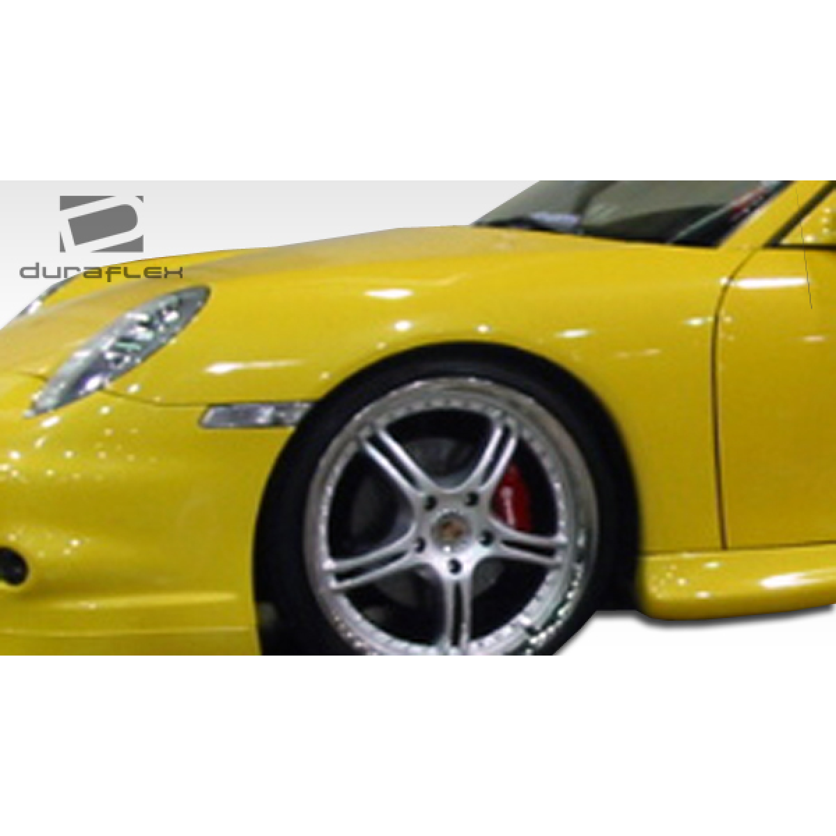 Modify your Porsche 911 1999 with our Exterior/Complete Body Kits - Front quarter angle view of a yellow Porsche 911