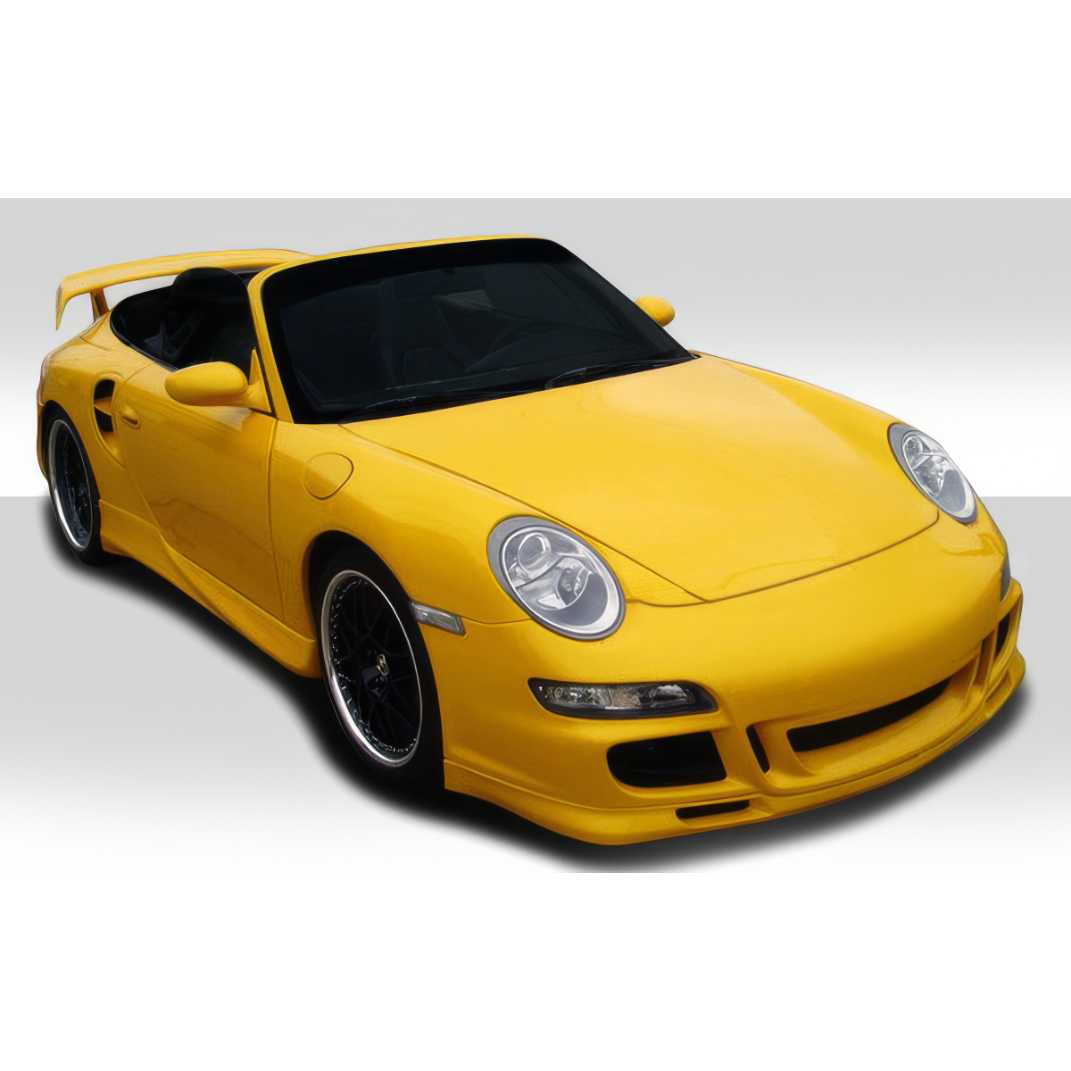 Modify your Porsche 911 1999 with our Exterior/Complete Body Kits - Front three quarter angle view of yellow Porsche