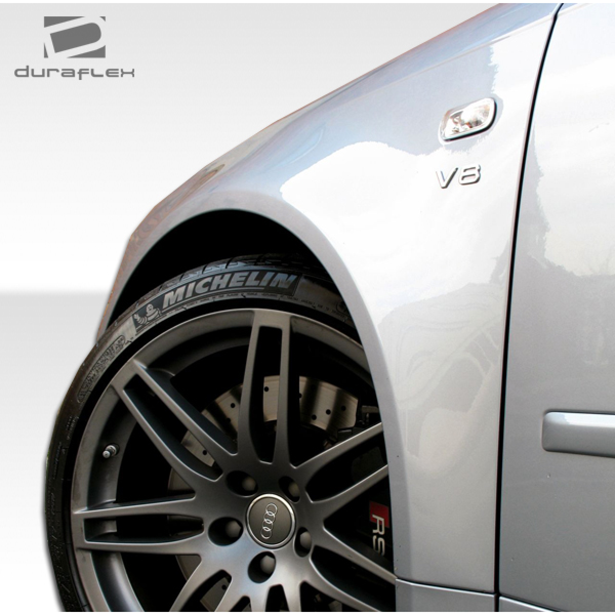 Modify your Audi A4 2006 with our Exterior/Fenders - Close-up angle of front fender and wheel