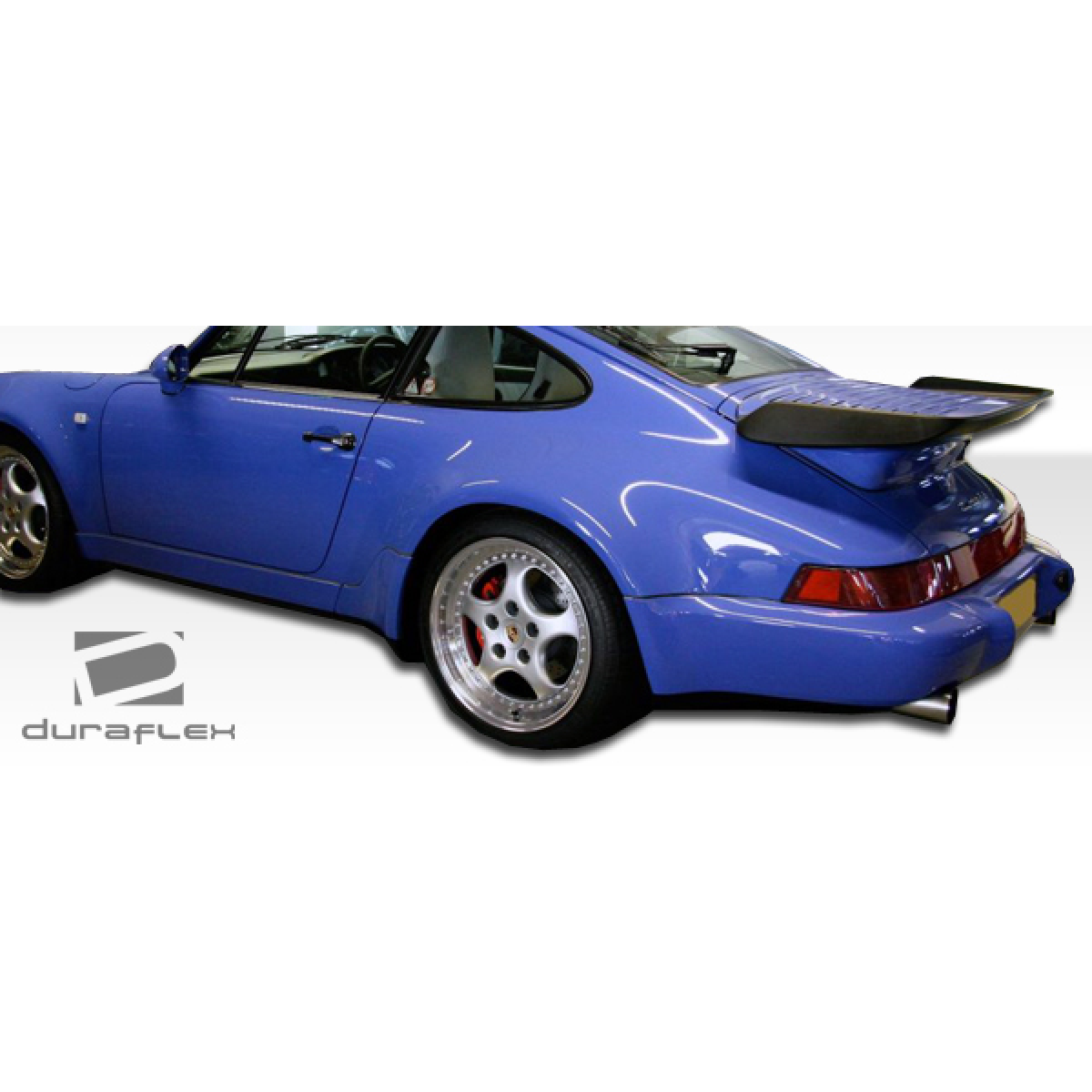 Modify your Porsche 911 1989 with our Exterior/Side Skirts - Angle view of the side and rear of the vehicle