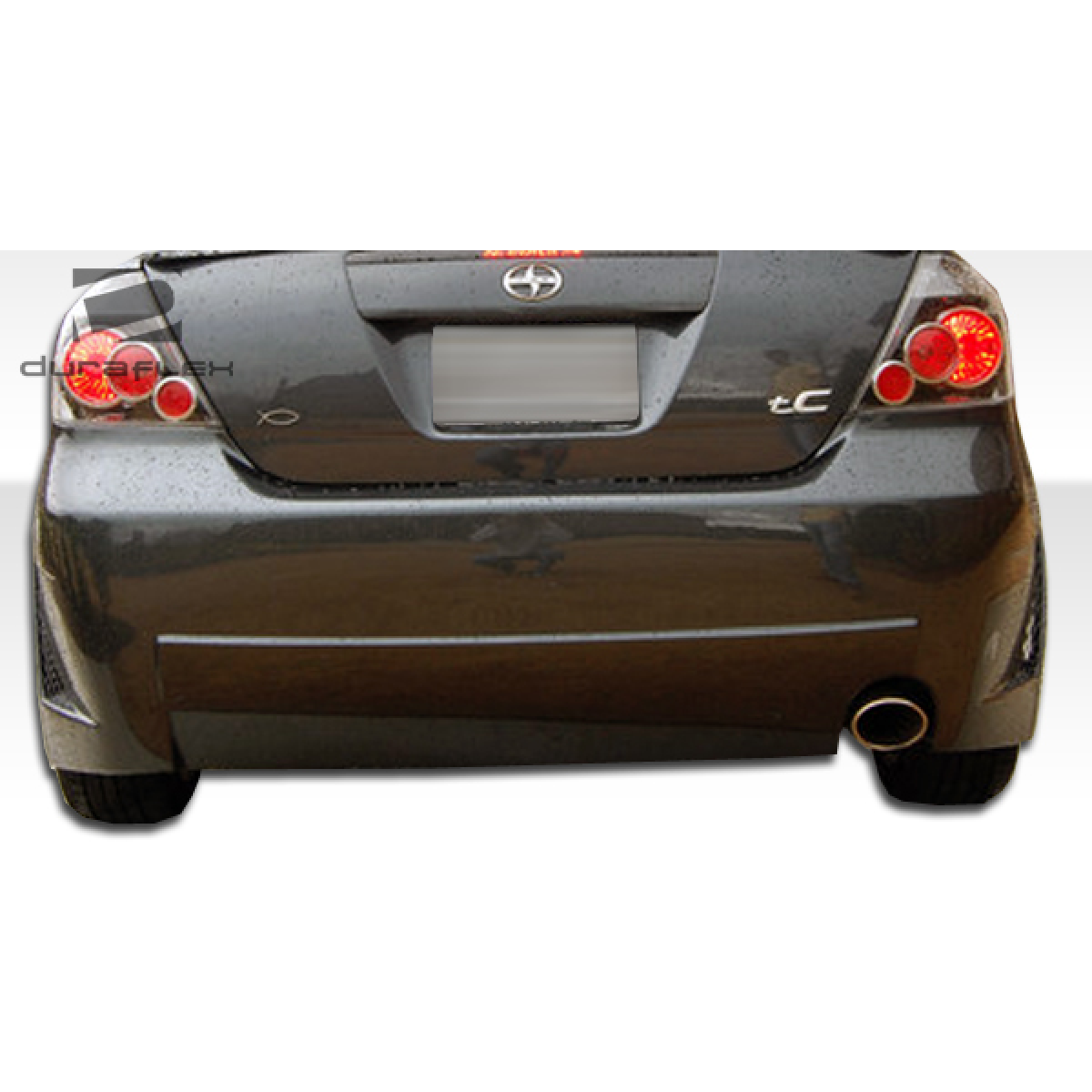 Modify your Scion tC 2005 with our Exterior/Rear Bumpers or Lips - Image shows rear view at a frontal angle