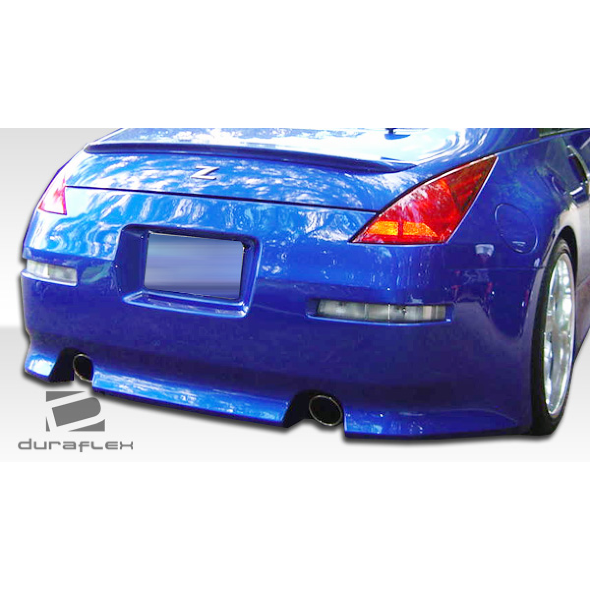 Modify your Nissan 350Z 2003 with our Exterior/Complete Body Kits - Rear view angle of a blue Nissan 350Z