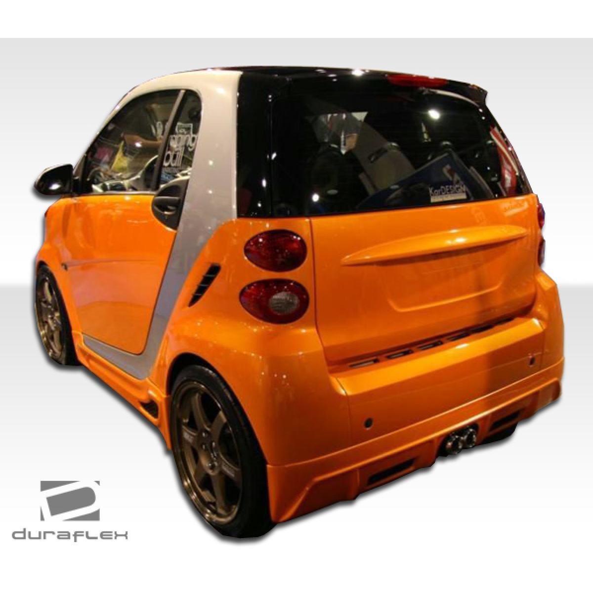 Modify your Smart fortwo 2008 with our Exterior/Complete Body Kits - Rear three quarter angle view of the car