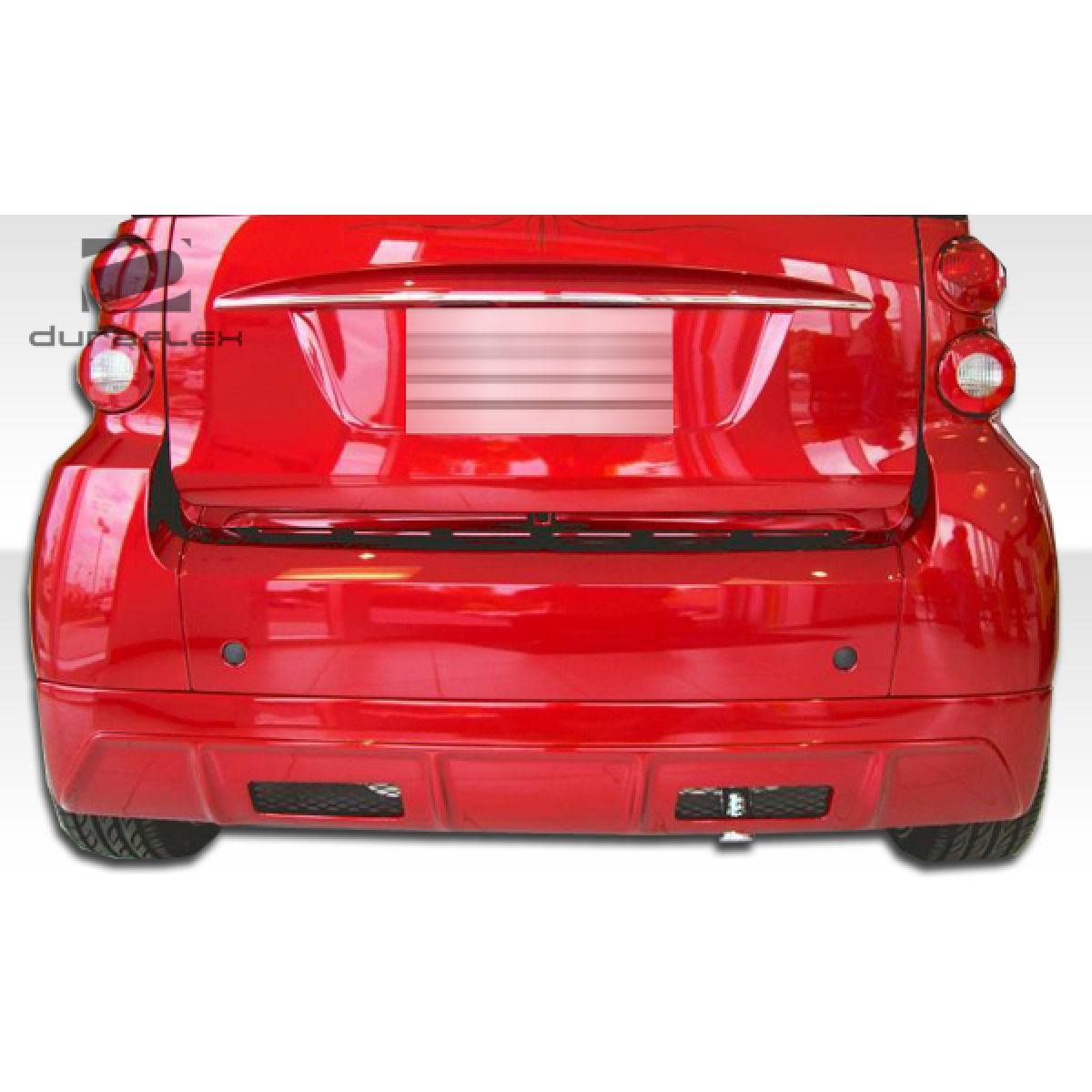 Modify your Smart fortwo 2008 with our Exterior/Complete Body Kits - Rear view of a red Smart ForTwo vehicle