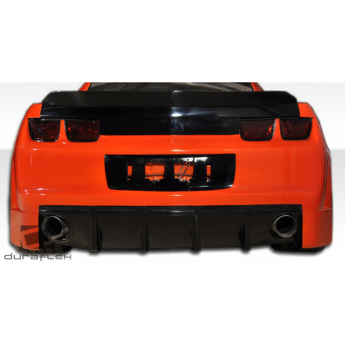 Modify your Chevrolet Camaro 2010 with our Exterior/Rear Bumpers or Lips - Rear view at a low angle showing bumper details