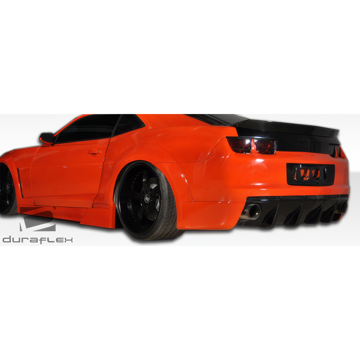 Modify your Chevrolet Camaro 2010 with our Exterior/Rear Bumpers or Lips - Slightly angled rear view of the car