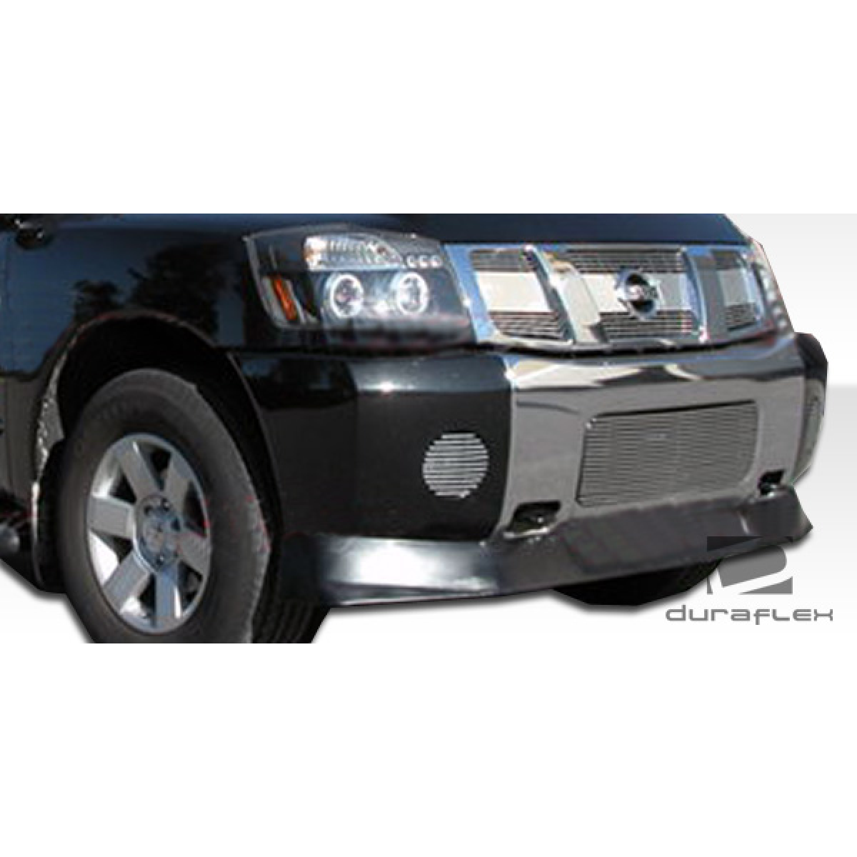 Modify your Nissan Titan 2004 with our Exterior/Front Lips - Front view of a vehicle part at a low angle