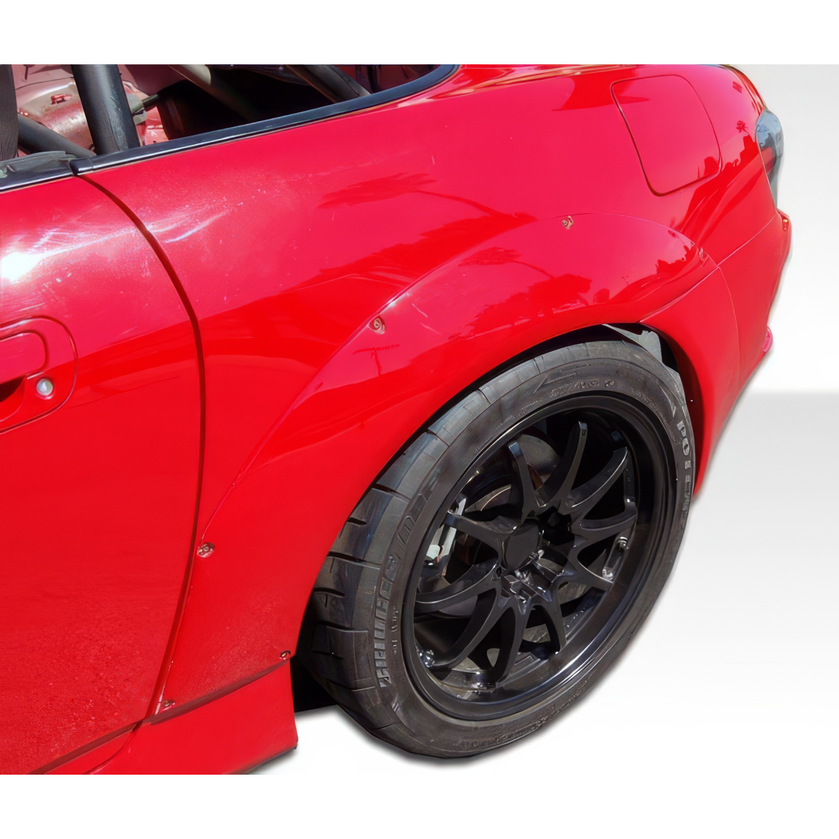 Modify your Honda S2000 2000 with our Exterior/Complete Body Kits - Angle shows rear side of car fender and wheel