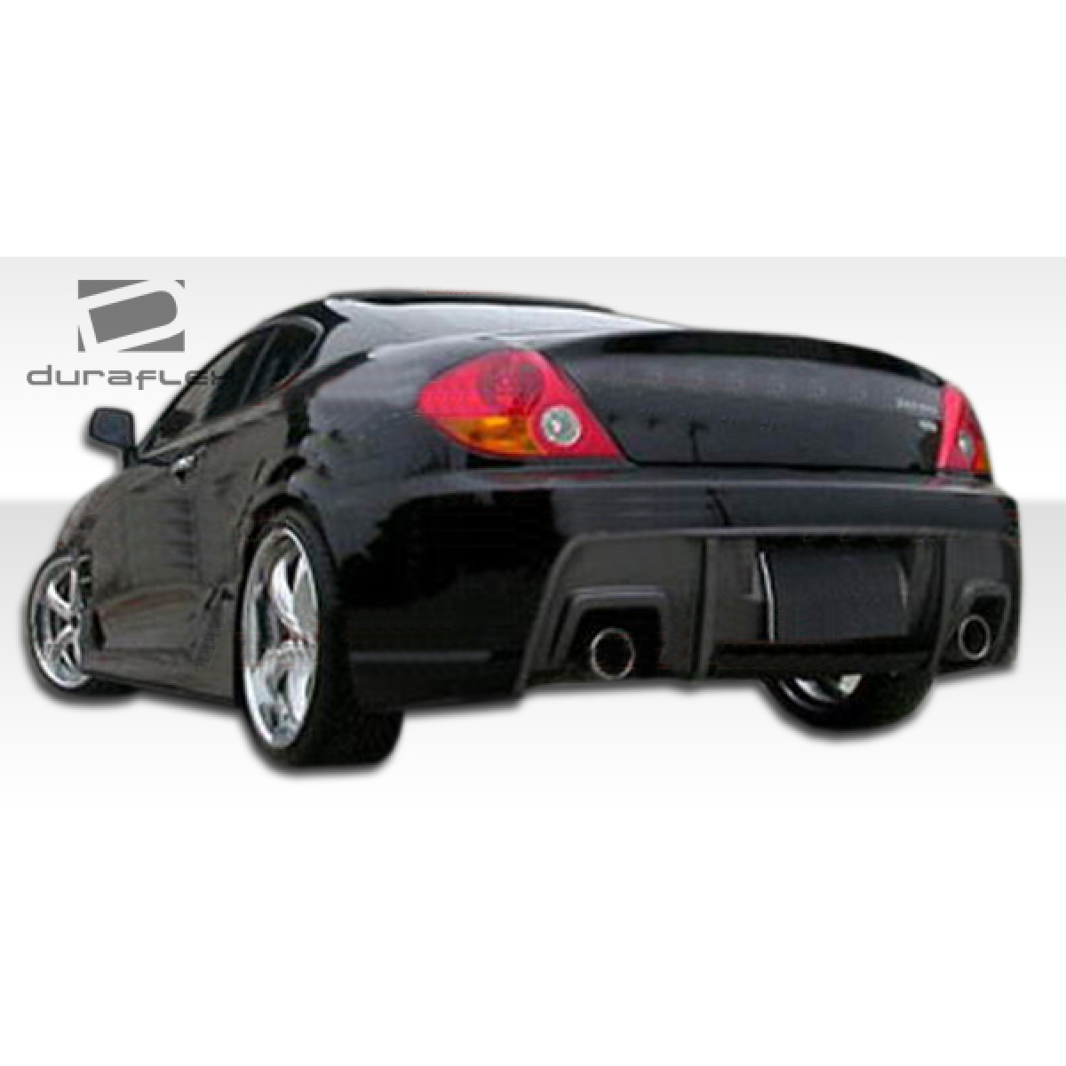 Modify your Hyundai Tiburon 2003 with our Exterior/Side Skirts - Rear angle view of side skirt on vehicle