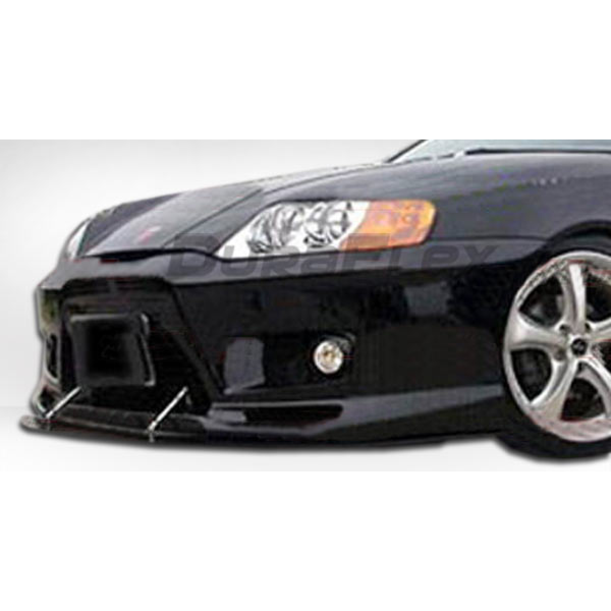 Modify your Hyundai Tiburon 2003 with our Exterior/Complete Body Kits - Front angled view of a body kit installed