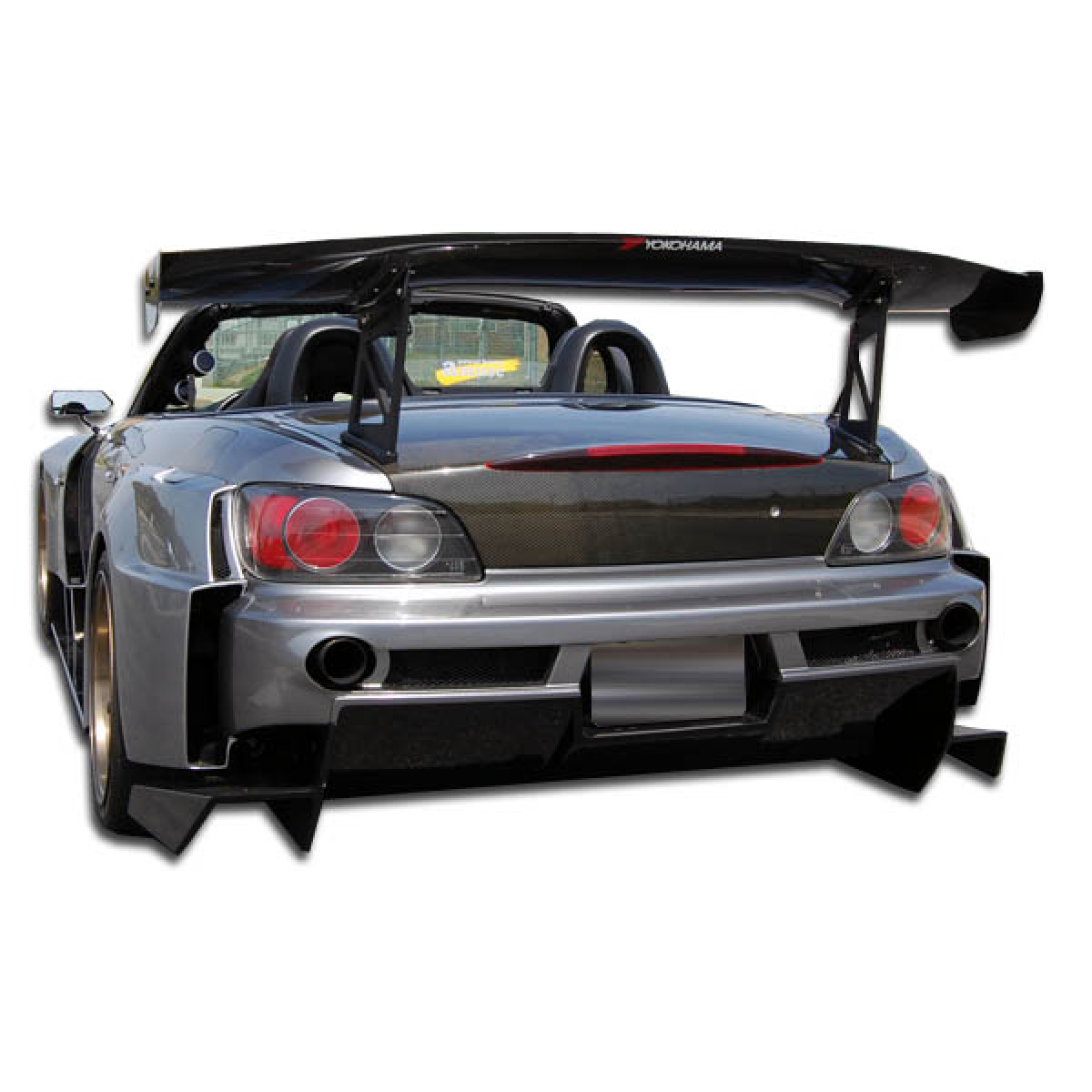 Modify your Honda S2000 2000 with our Exterior/Complete Body Kits - Rear view angle showcasing wide body bumper design