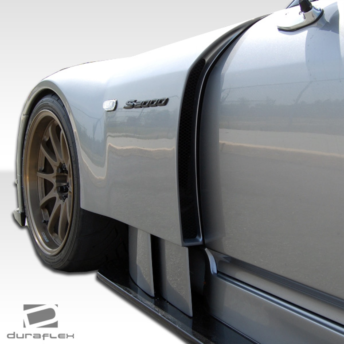 Modify your Honda S2000 2000 with our Exterior/Complete Body Kits - Viewed at an angle to show fender design details