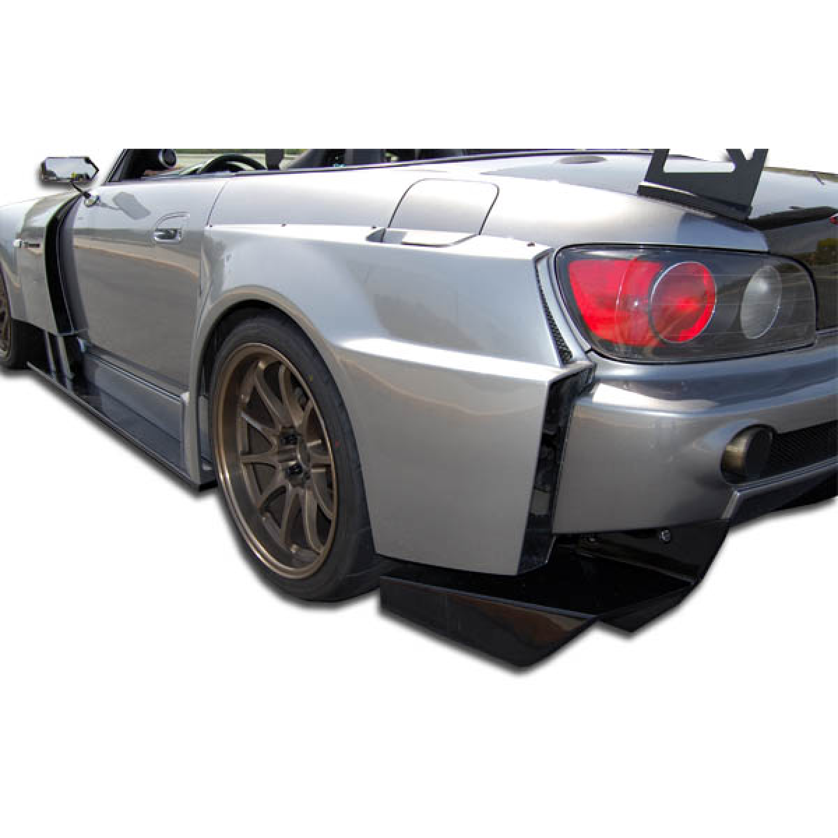 Modify your Honda S2000 2000 with our Exterior/Complete Body Kits - Angled view showing rear fender flares extension