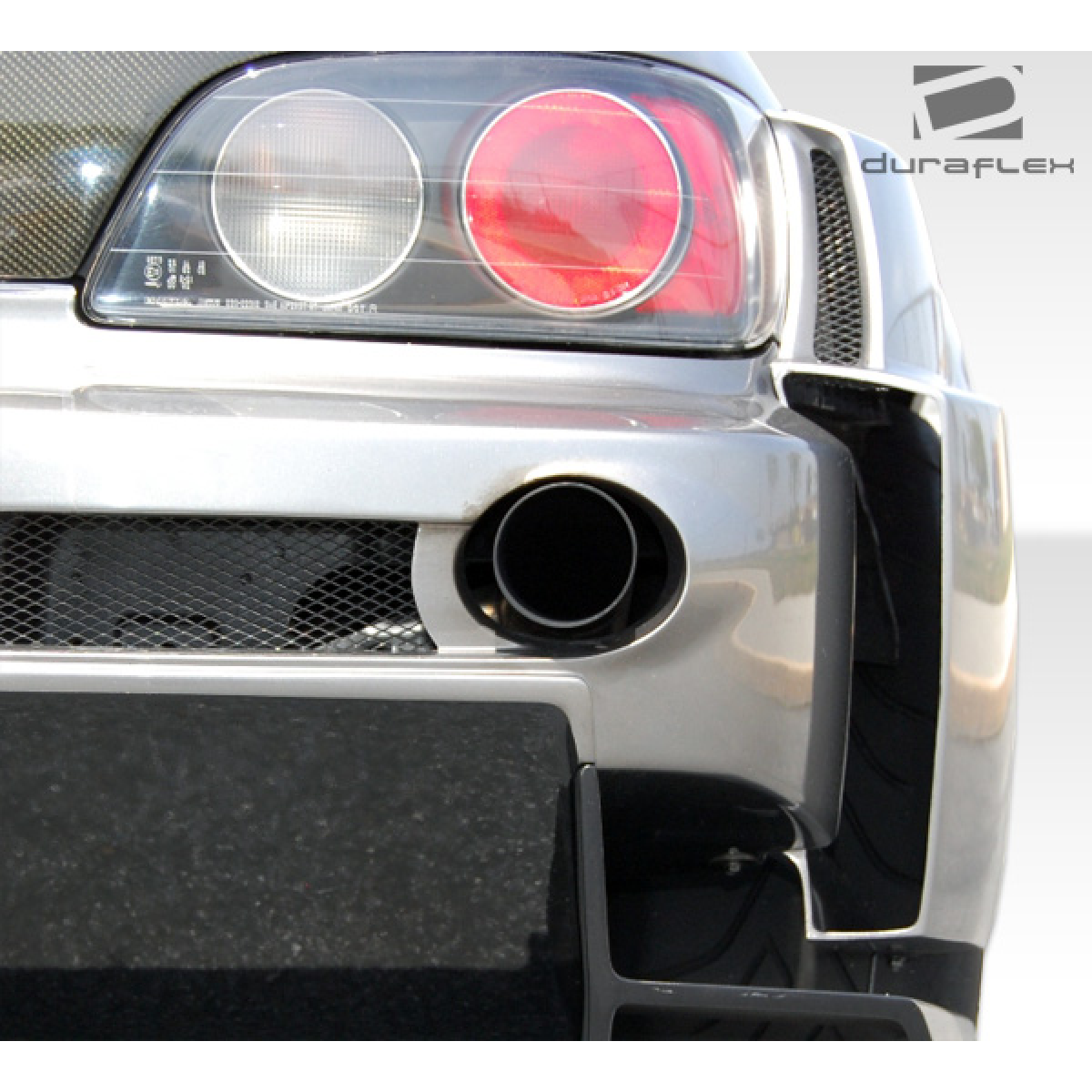 Modify your Honda S2000 2000 with our Exterior/Complete Body Kits - Rear view of vehicle showing exhaust and fender flares