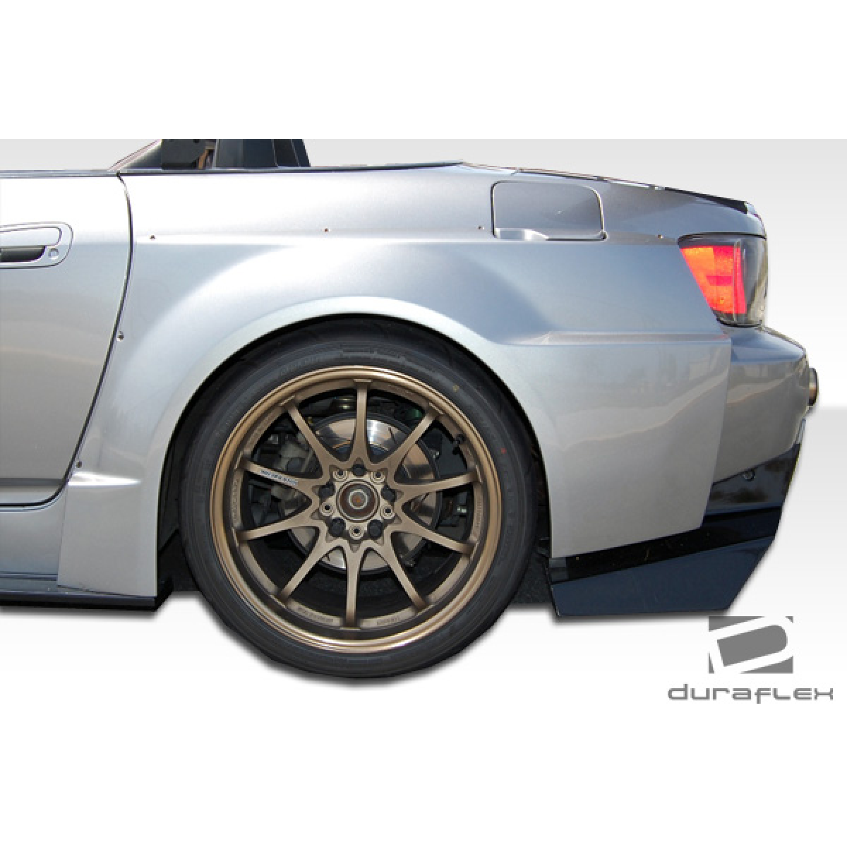 Modify your Honda S2000 2000 with our Exterior/Complete Body Kits - Side angle view of rear fender flare on car