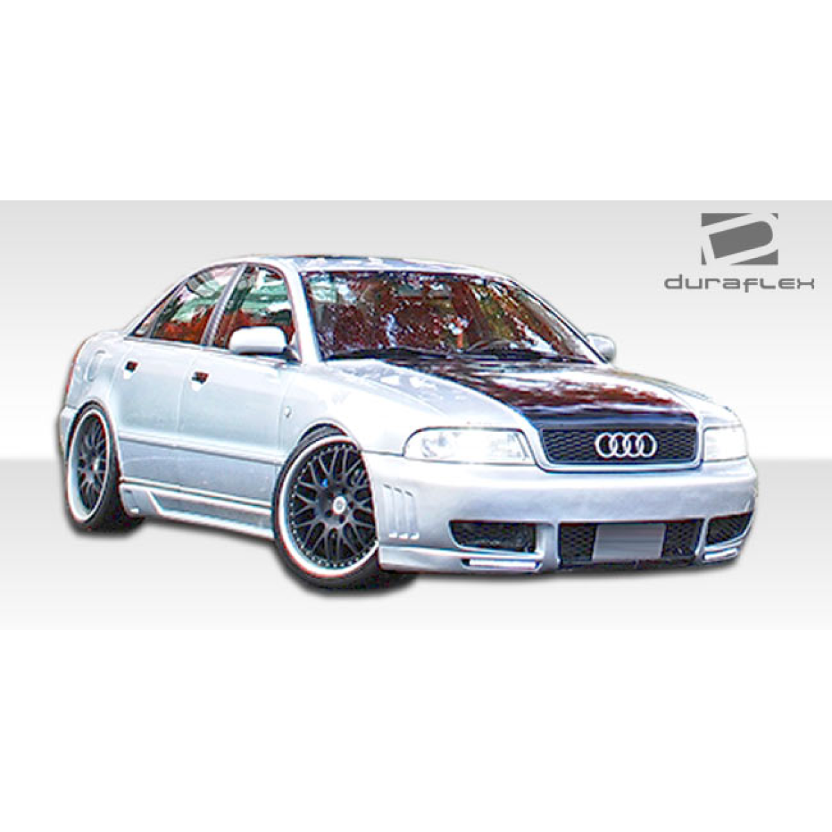 Modify your Audi A4 1996 with our Exterior/Front Bumpers - Front angle view of a modified Audi A4