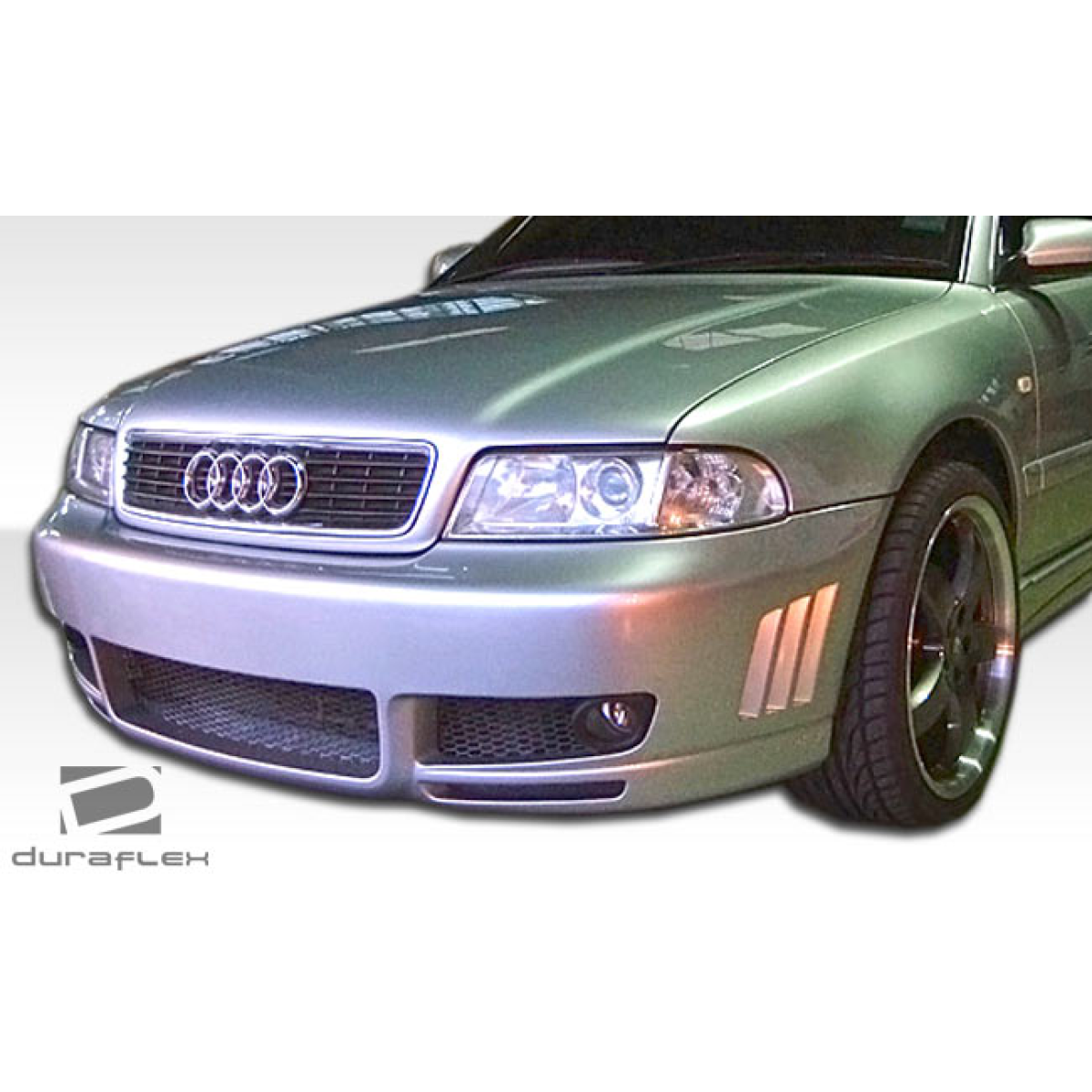 Modify your Audi A4 1996 with our Exterior/Front Bumpers - Front angle view of the vehicle part