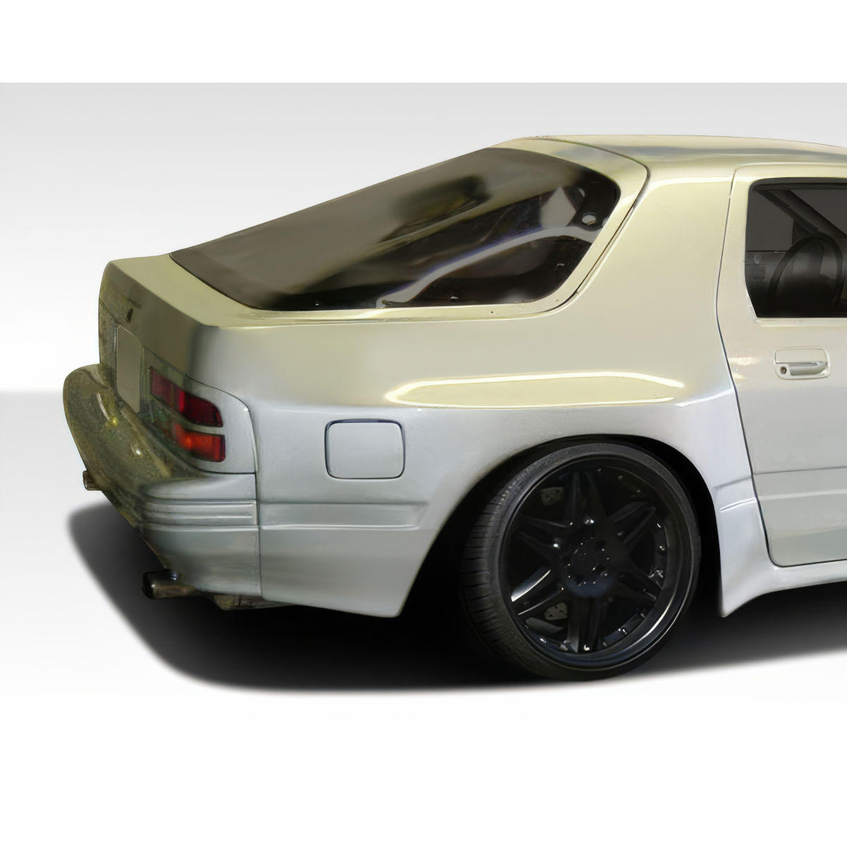 Modify your Mazda RX-7 1986 with our Exterior/Fenders - Rear three quarter angle view of the vehicle