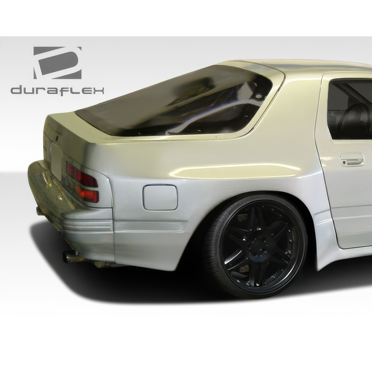 Modify your Mazda RX-7 1986 with our Exterior/Fenders - Rear view at a slight angle to the side