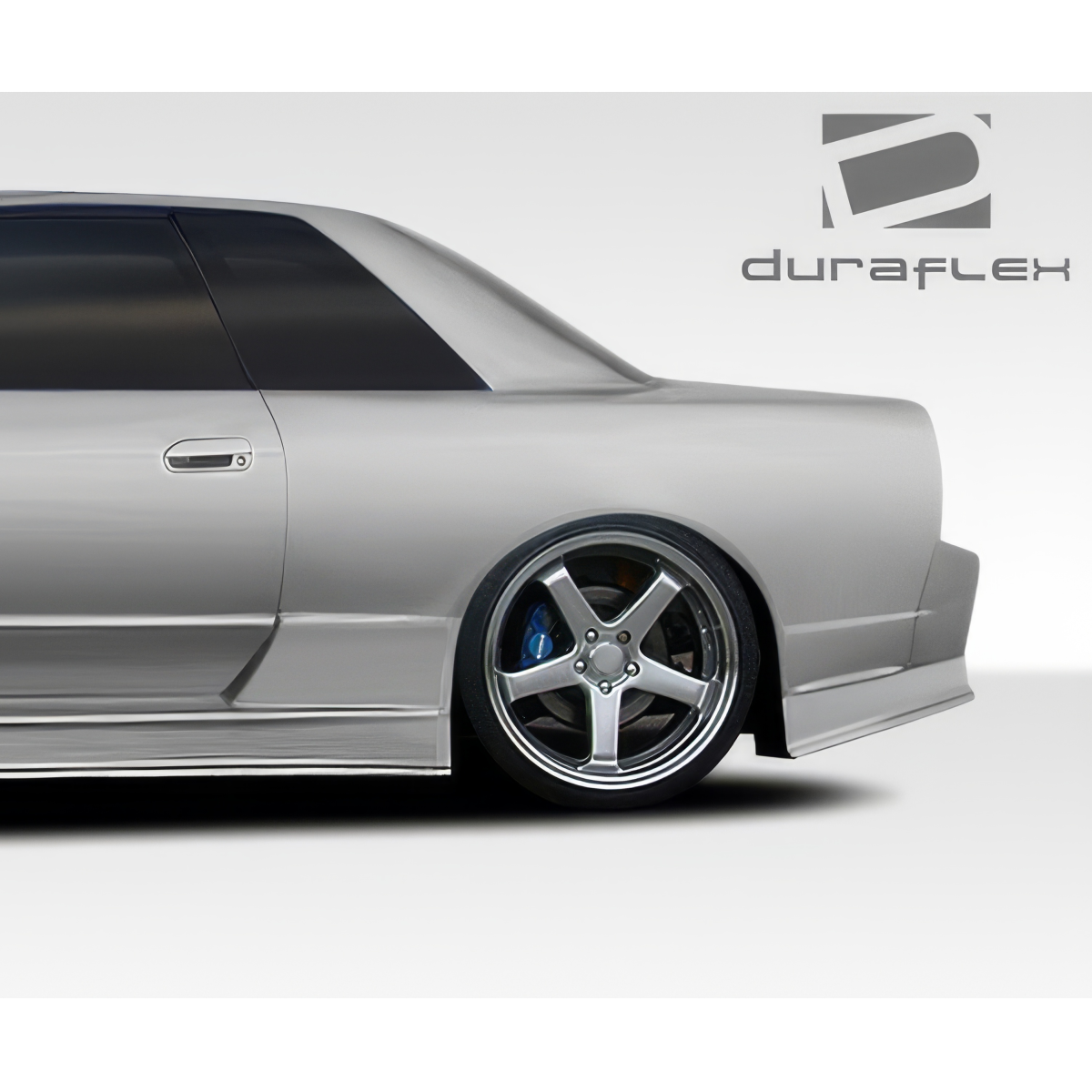 Modify your Nissan Skyline 1989 with our Exterior/Complete Body Kits - Side angle view of the rear of the car