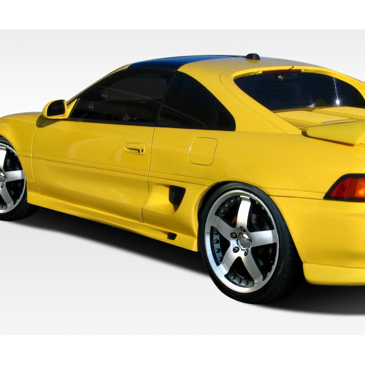 Modify your Toyota MR2 1991 with our Exterior/Side Skirts - Side angle view of the vehicle showing skirts