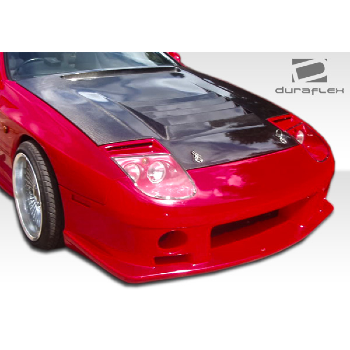 Modify your Mazda RX-7 1986 with our Exterior/Front Bumpers - Showing front view at a slight angle