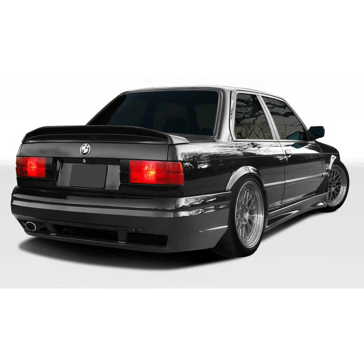 Modify your BMW 3-Series 1984 with our Exterior/Rear Bumpers or Lips - Rear angle view of the BMW 3 Series E30