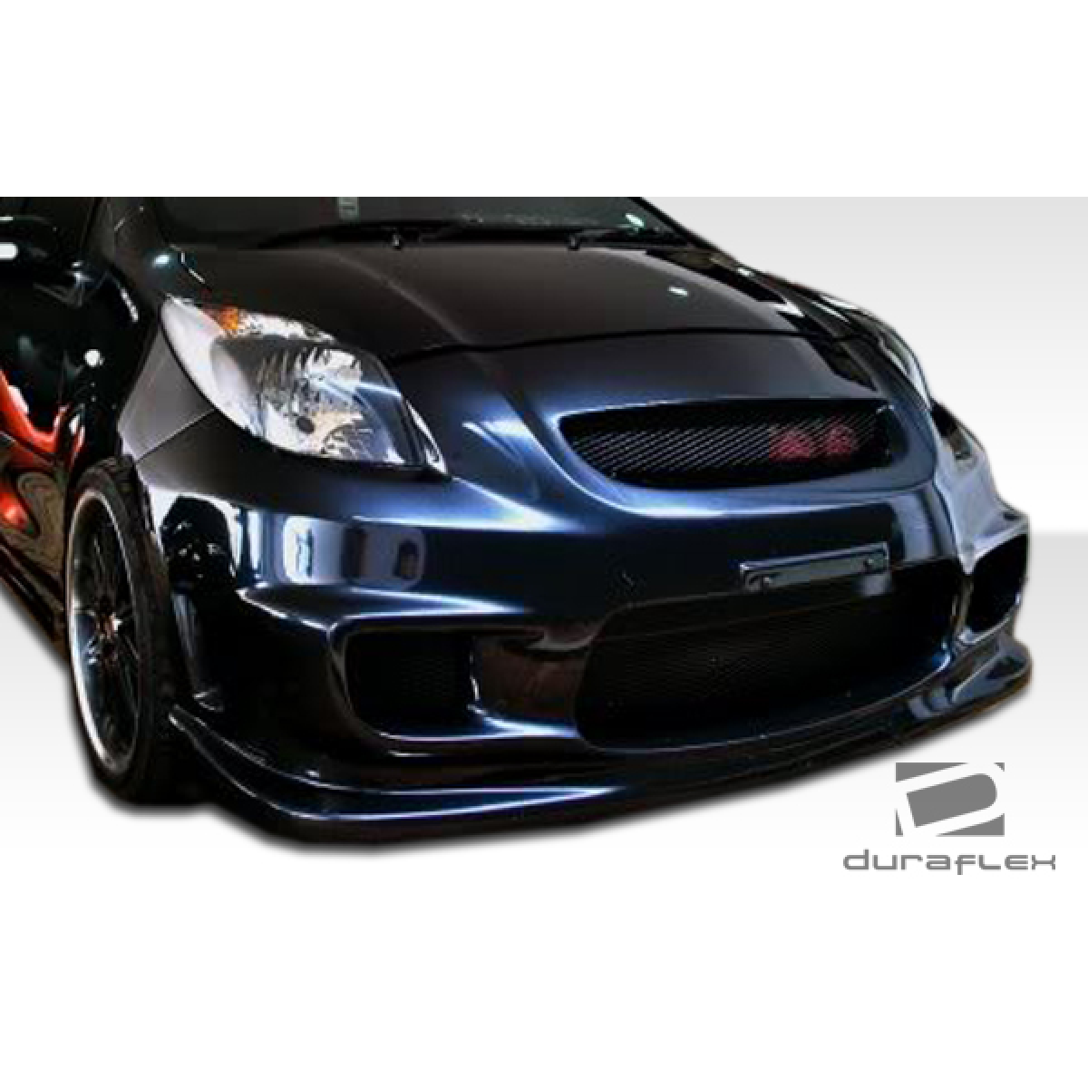 Modify your Toyota Yaris 2007 with our Exterior/Front Bumpers or Lips - Front view at a slight angle from the side