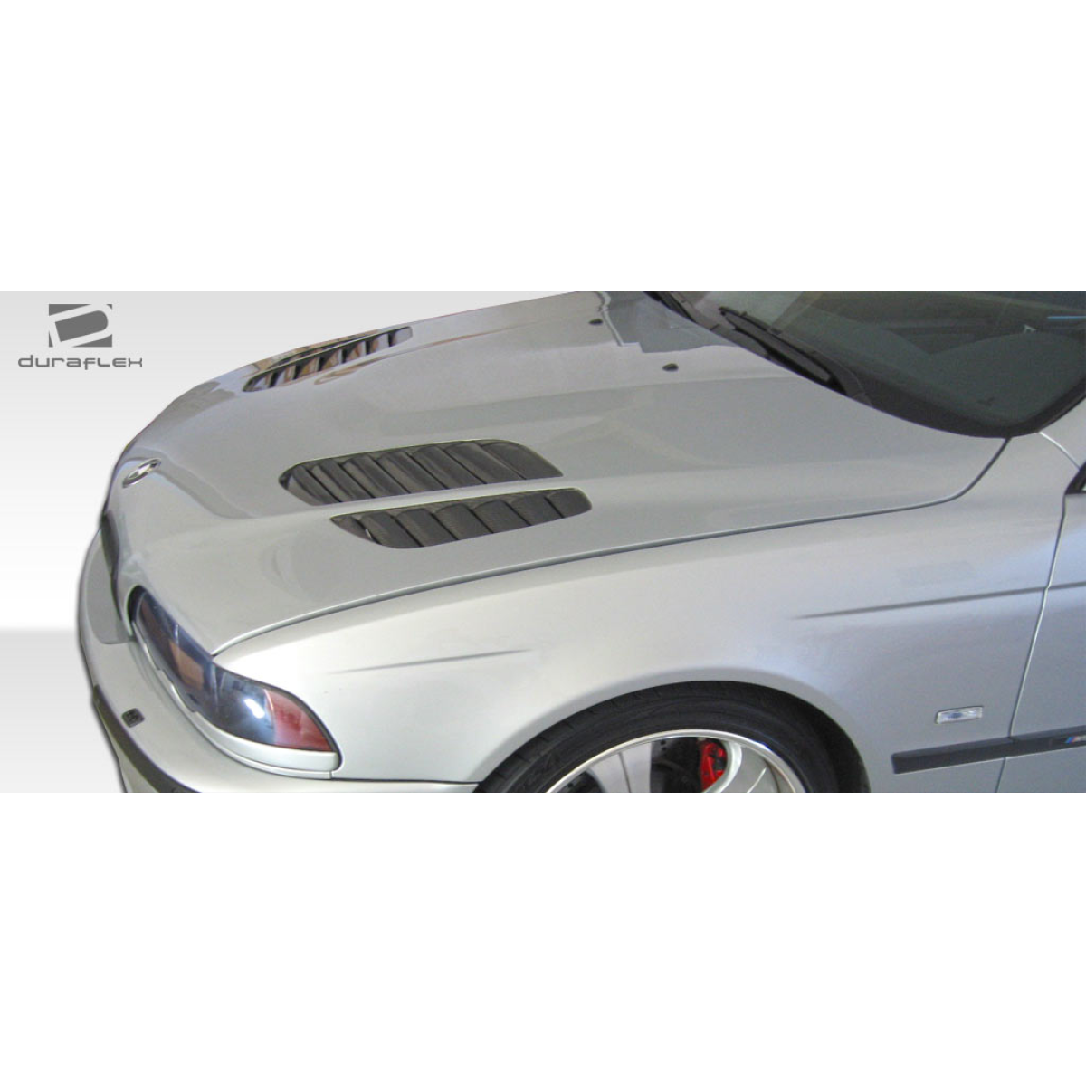 Modify your BMW 5-Series 1997 with our Exterior/Hoods - Angled view of BMW hood with vents visible