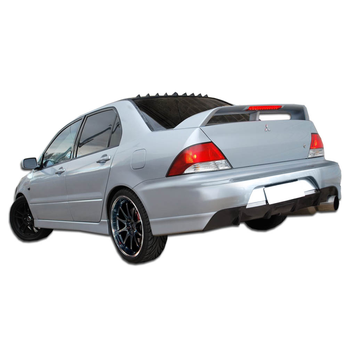Modify your Mitsubishi Lancer 2002 with our Exterior/Rear Bumpers - Rear three quarter angle view of the vehicle
