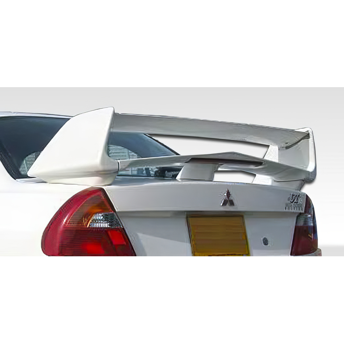 Modify your Mitsubishi Mirage 1997 with our Exterior/Wings - Rear view angle showing wing attachment