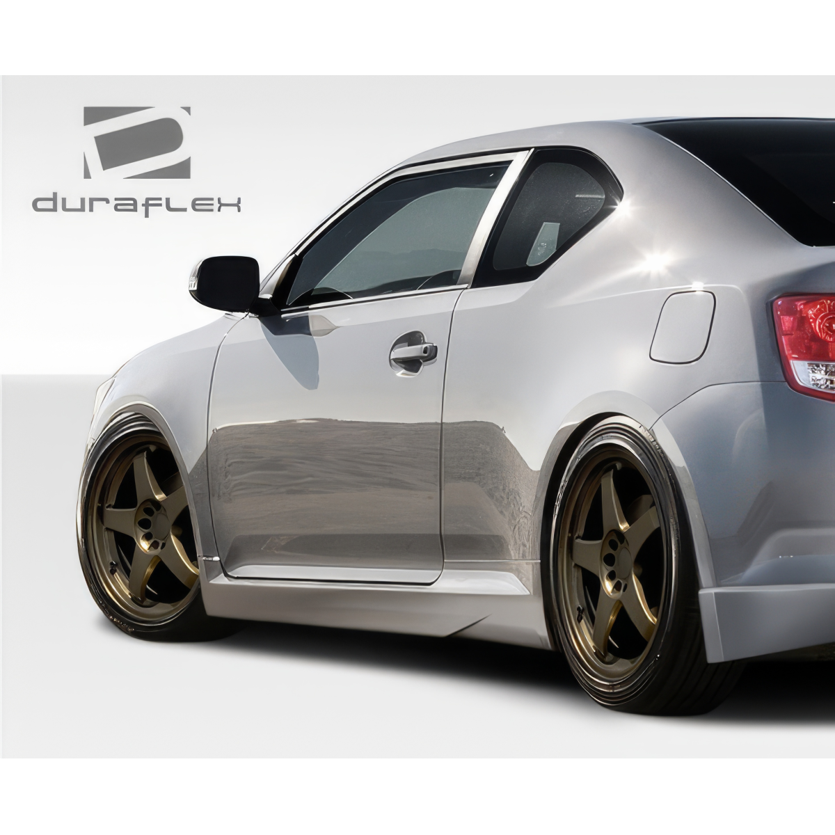 Modify your Scion tC 2011 with our Exterior/Side Skirts - Side angle view of Scion tC showcasing side skirts