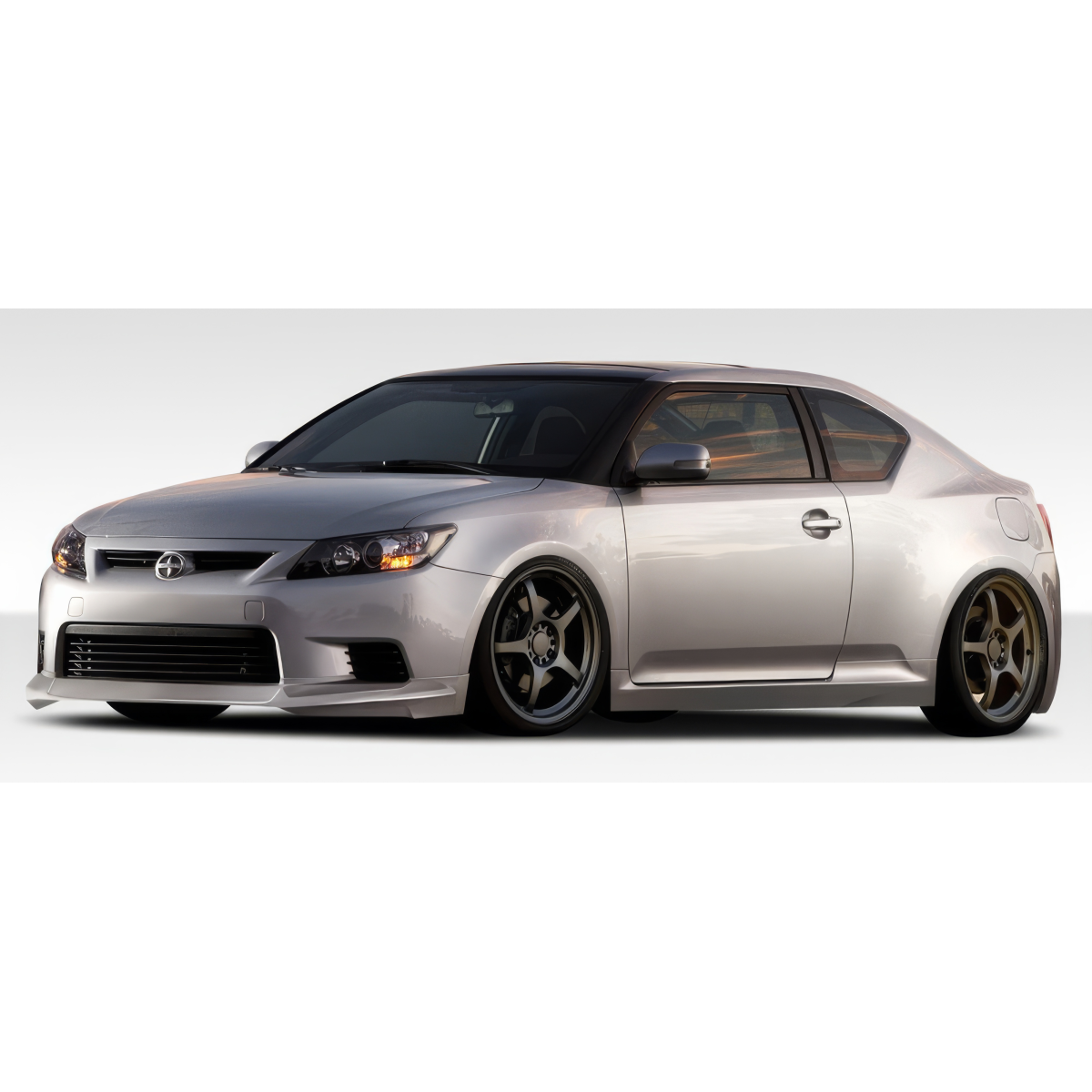 Modify your Scion tC 2011 with our Exterior/Complete Body Kits - Side view of the car at a slight angle