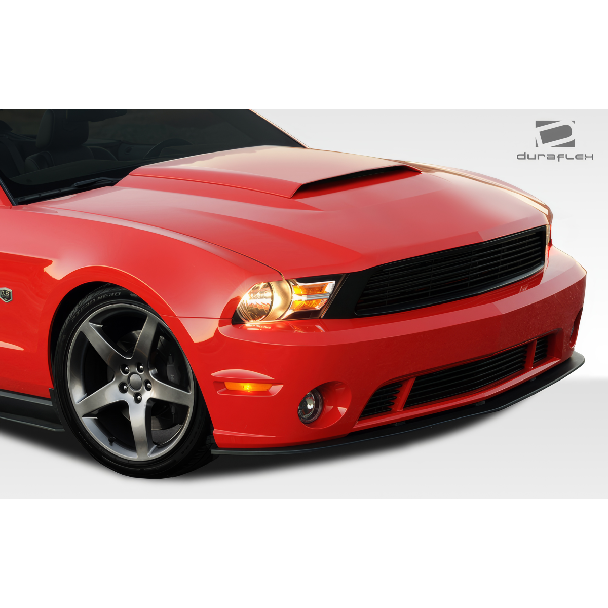 Modify your Ford Mustang 2010 with our Exterior/Front Bumpers or Lips - Front angle view of a red Ford Mustang