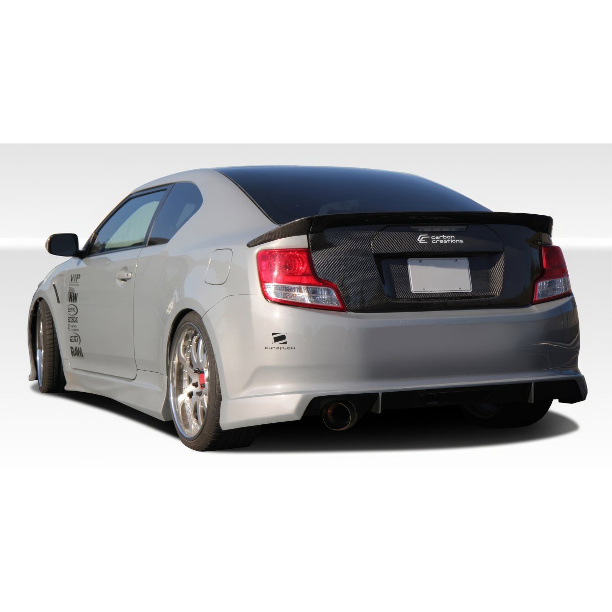 Modify your Scion tC 2011 with our Exterior/Complete Body Kits - Angle shows part from the rear side perspective