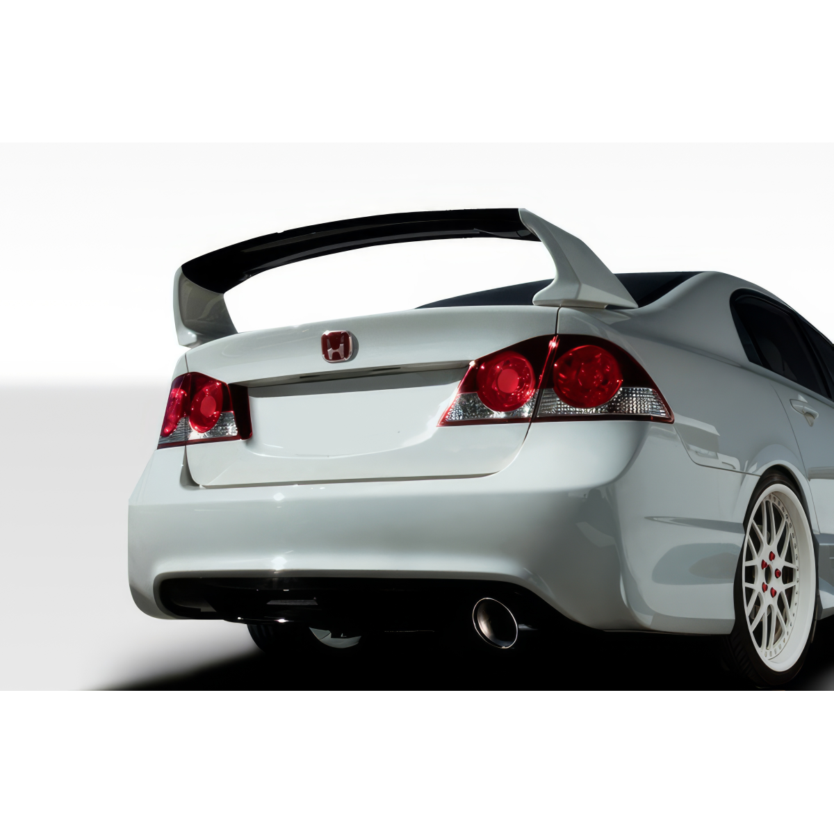 Modify your Honda Civic 2006 with our Exterior/Rear Bumpers or Lips - The image shows a rear angle view of the car