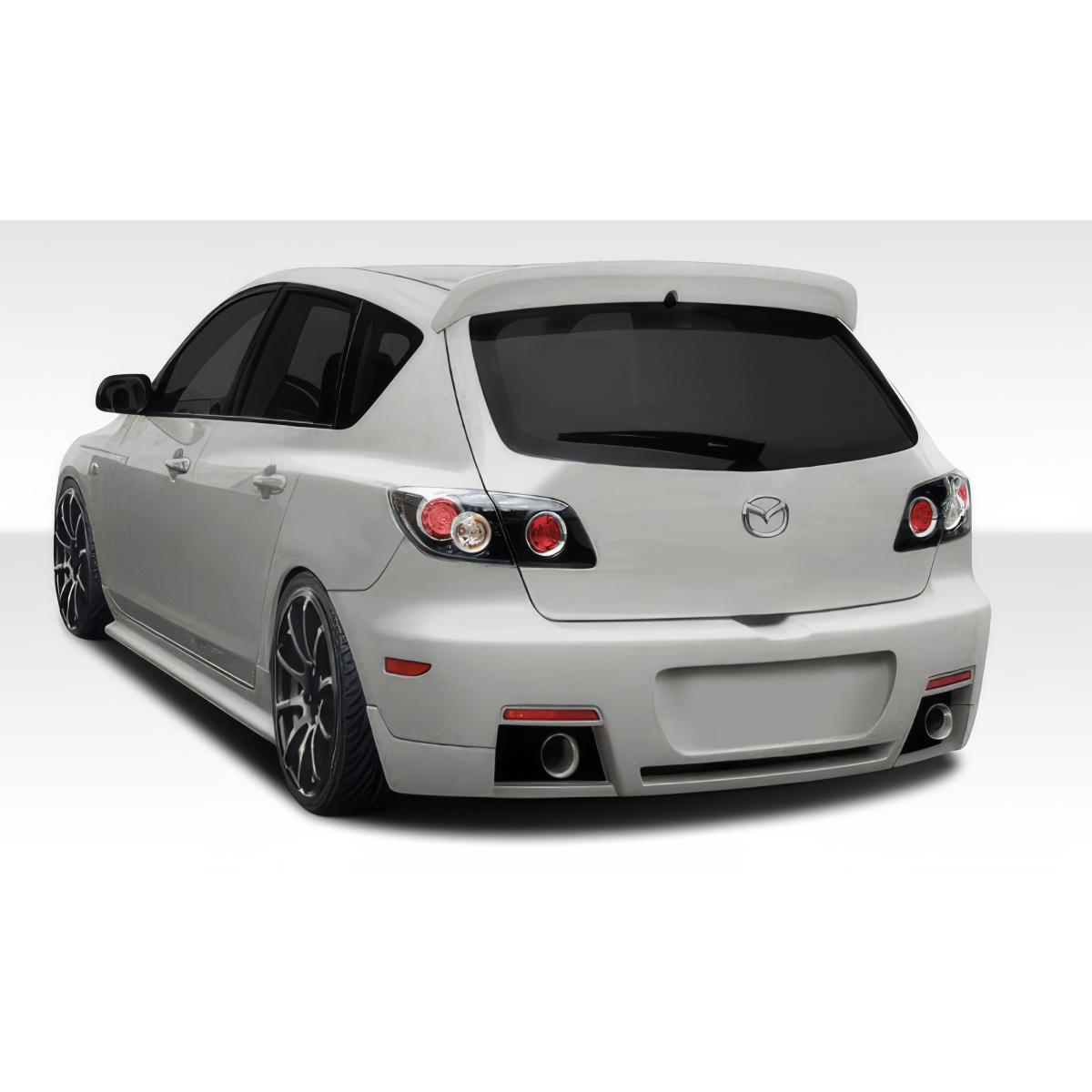 Modify your Mazda 3 2004 with our Exterior/Rear Bumpers or Lips - Rear angle view of vehicle showing rear bumper