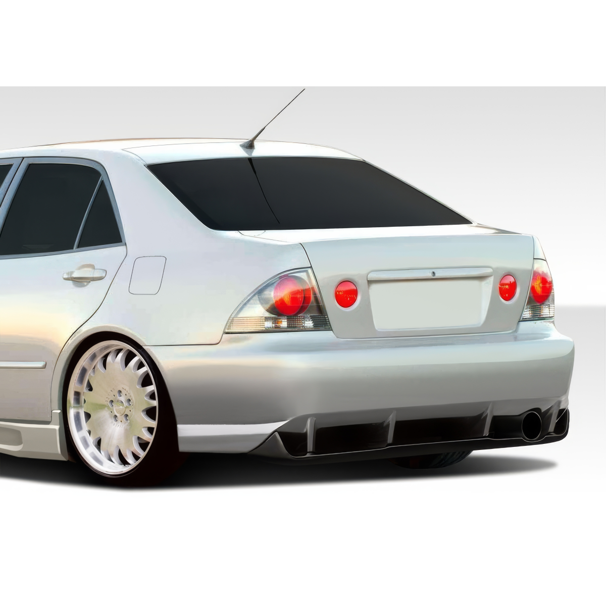 Modify your Lexus IS Series 2000 with our Exterior/Complete Body Kits - Rear angle of a modified car showing rear bumper