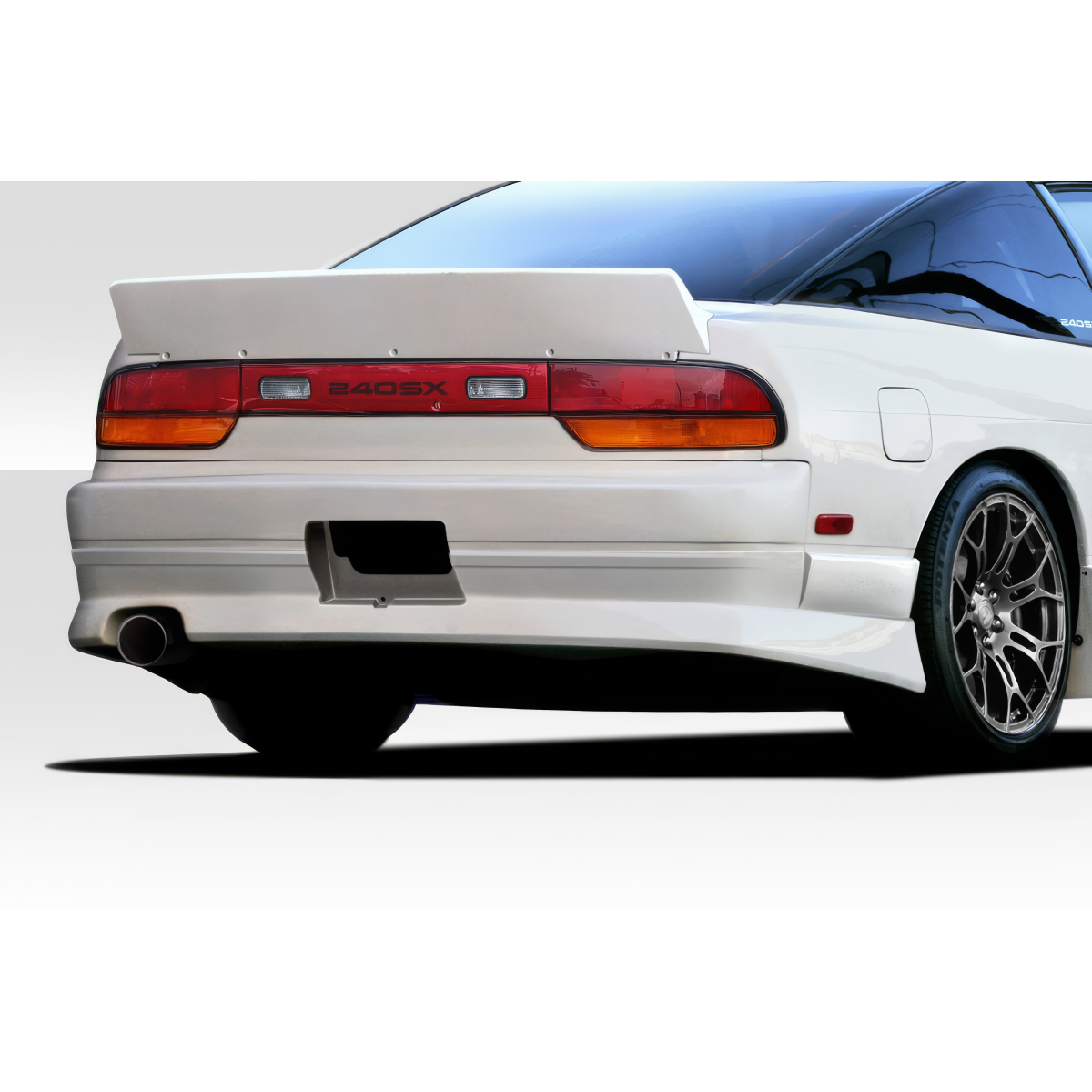 Modify your Nissan 240SX 1989 with our Exterior/Complete Body Kits - Rear view from a low angle showing bumper design