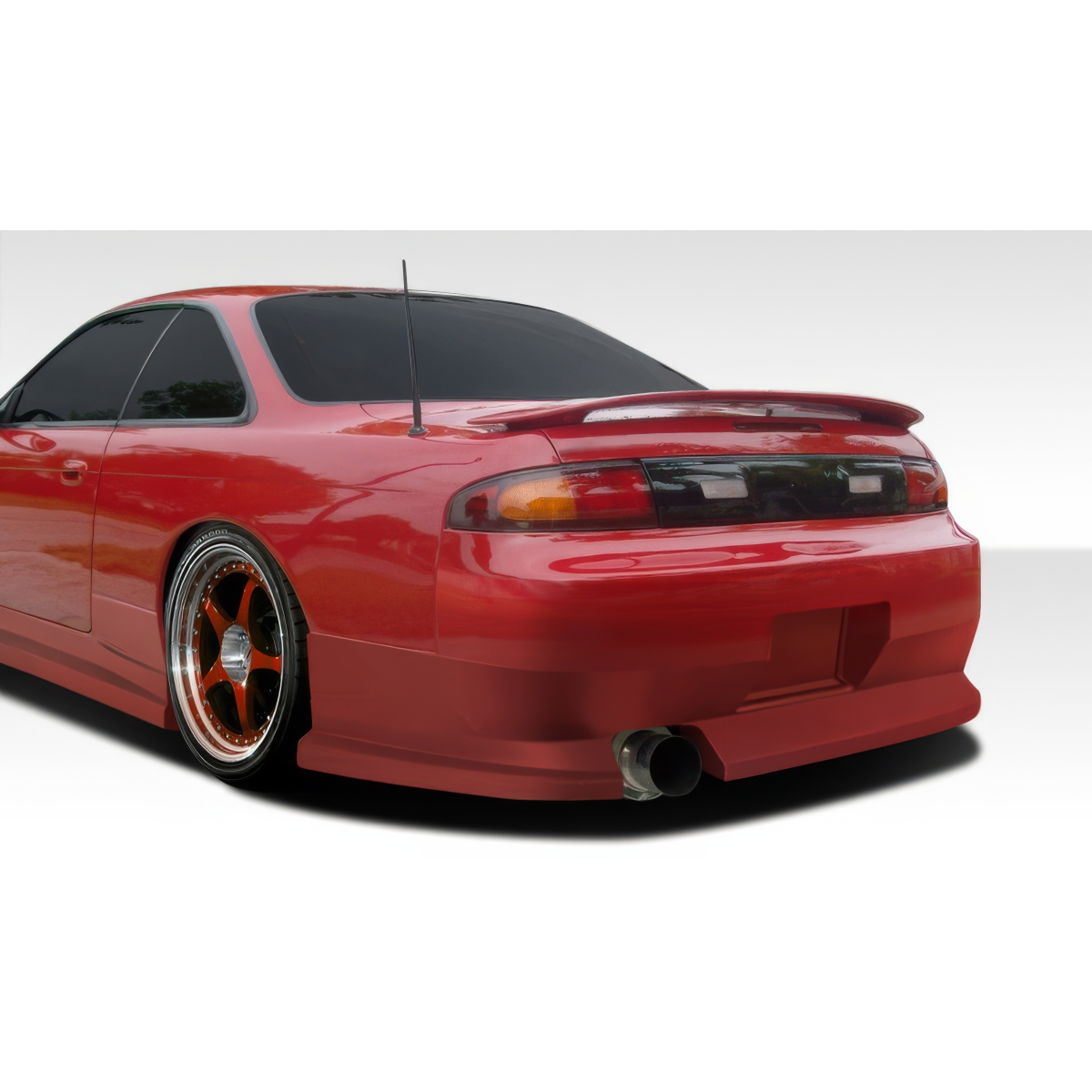 Modify your Nissan 240SX 1995 with our Exterior/Rear Bumpers or Lips - Rear three quarter view of the vehicle