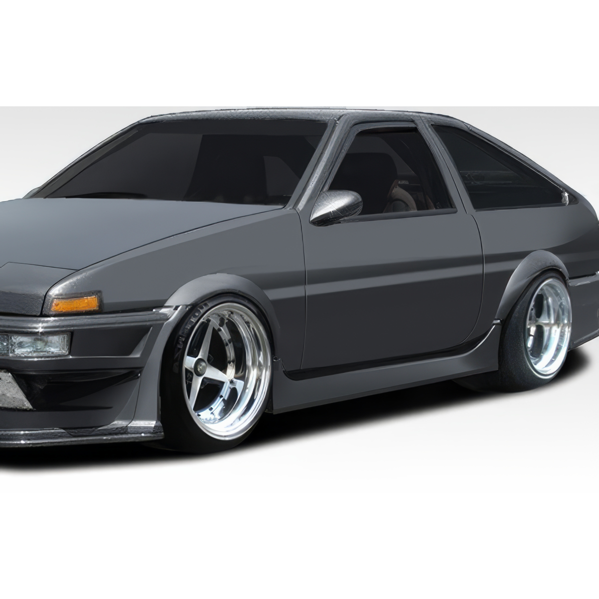 Modify your Toyota Corolla 1984 with our Exterior/Complete Body Kits - Front quarter view of the car at a slight angle