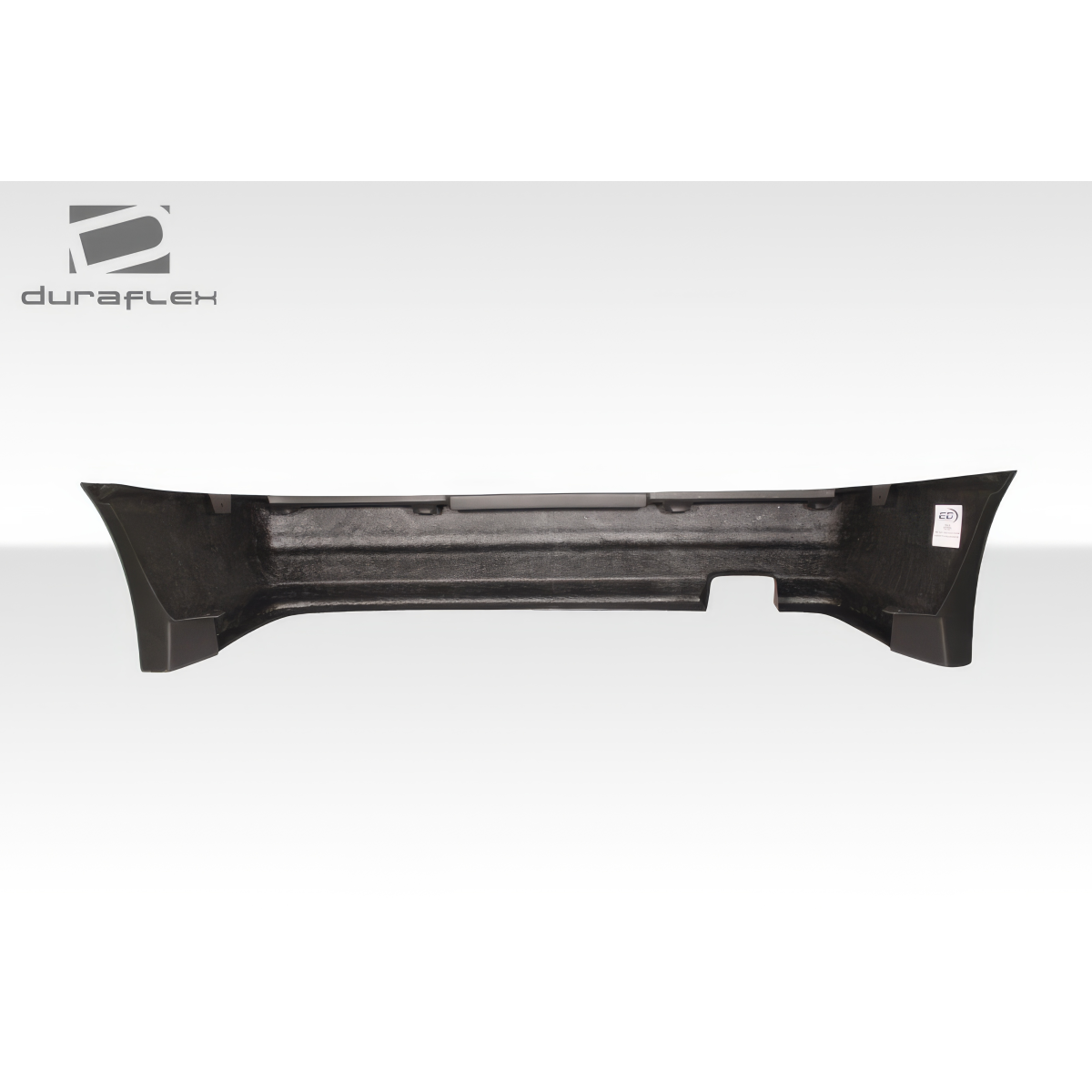 Modify your Toyota Corolla 1984 with our Exterior/Rear Bumpers or Lips - Side view of a rear bumper part