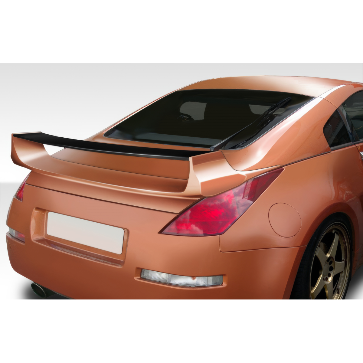 Modify your Nissan 350Z 2003 with our Exterior/Complete Body Kits - Rear angle view of a Nissan 350Z with spoiler