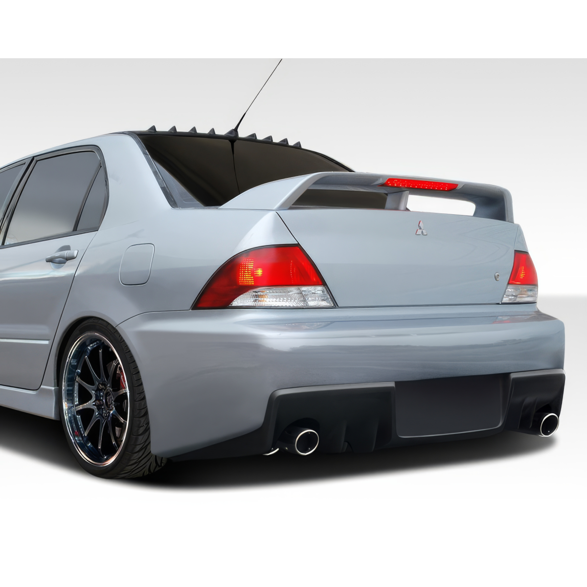 Modify your Mitsubishi Lancer 2002 with our Exterior/Complete Body Kits - Rear three quarter view of the car