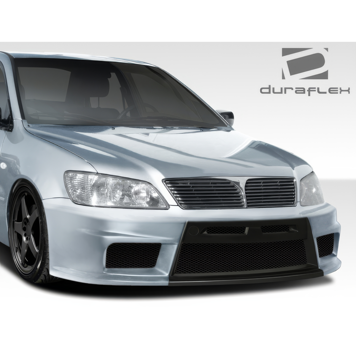 Modify your Mitsubishi Lancer 2002 with our Exterior/Complete Body Kits - Front angle of vehicle showing body kit details