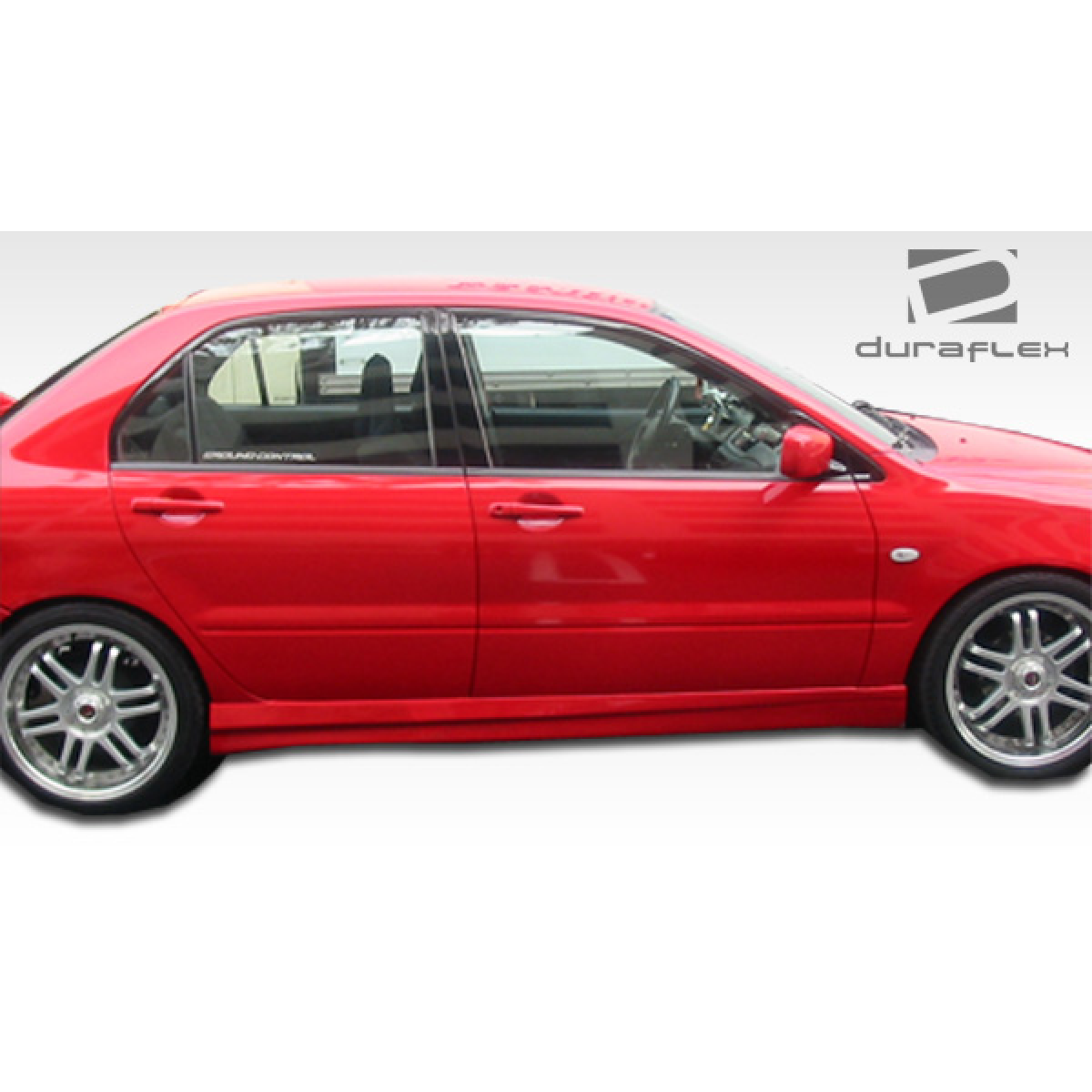 Modify your Mitsubishi Lancer 2002 with our Exterior/Complete Body Kits - Side view of a red Mitsubishi Lancer