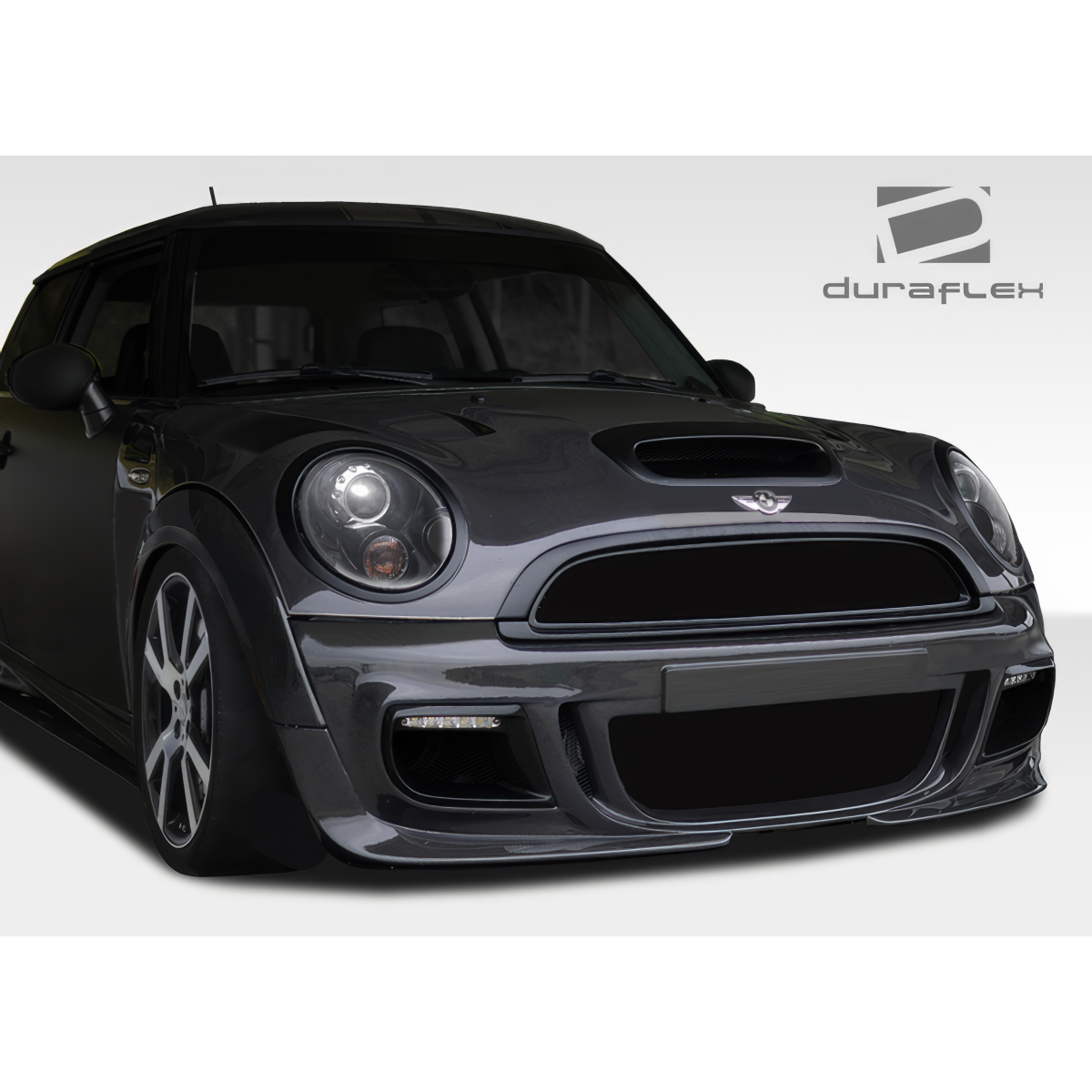 Modify your Mini Cooper 2007 with our Exterior/Front Bumpers or Lips - Front angle focusing on the bumper design