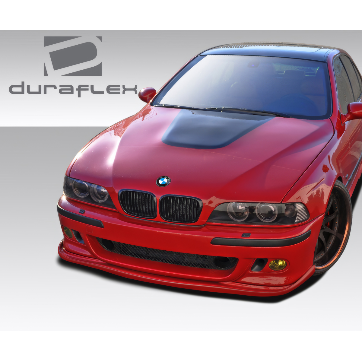 Modify your BMW 5-Series 1997 with our Exterior/Front Bumpers or Lips - Front angle view of a BMW 5-Series with a body kit